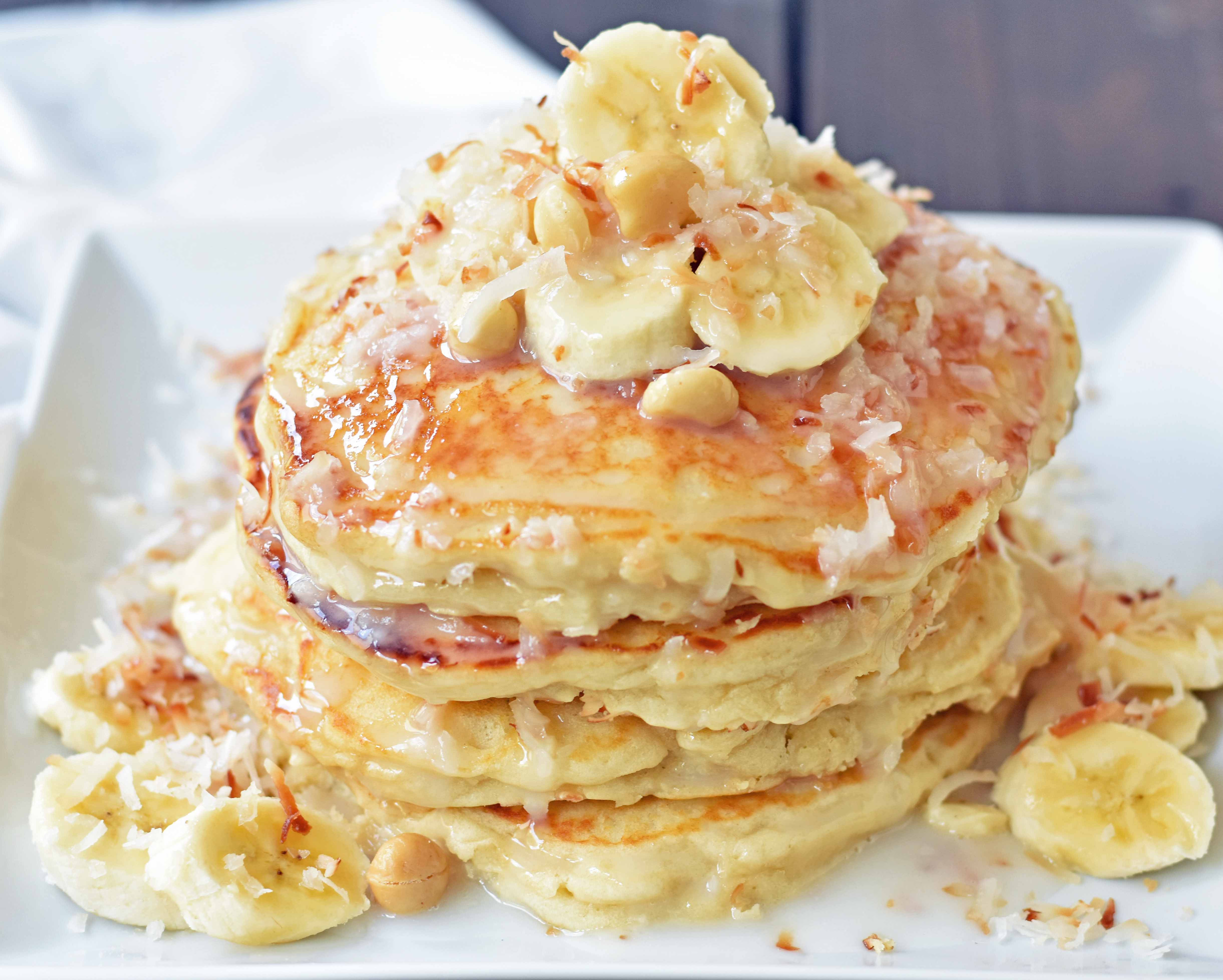 Toasted Coconut Macadamia Pancakes with Coconut Syrup are the most perfect tropical pancakes. Light and fluffy toasted coconut pancakes topped with homemade coconut syrup and macadamia nuts. www.modernhoney.com