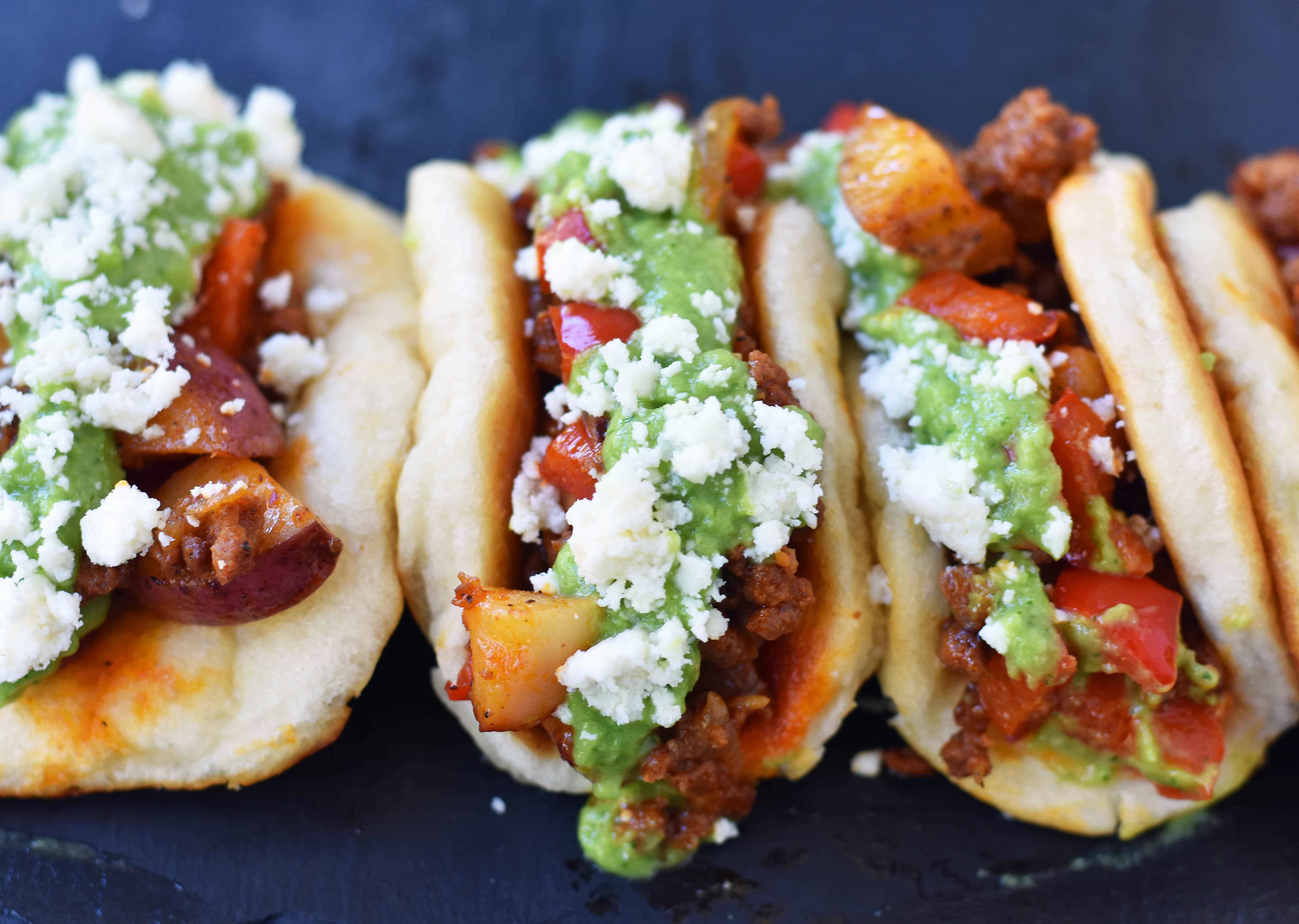 Chorizo Potato Puffy Tacos from Melissa Stadler 46th Pillsbury Bake-Off Contest. Puffy Tacos made with Pillsbury biscuit dough and filled with spicy chorizo, seasoned potatoes and peppers, a creamy avocado tomatillo crema, and cotija cheese. www.modernhoney.com