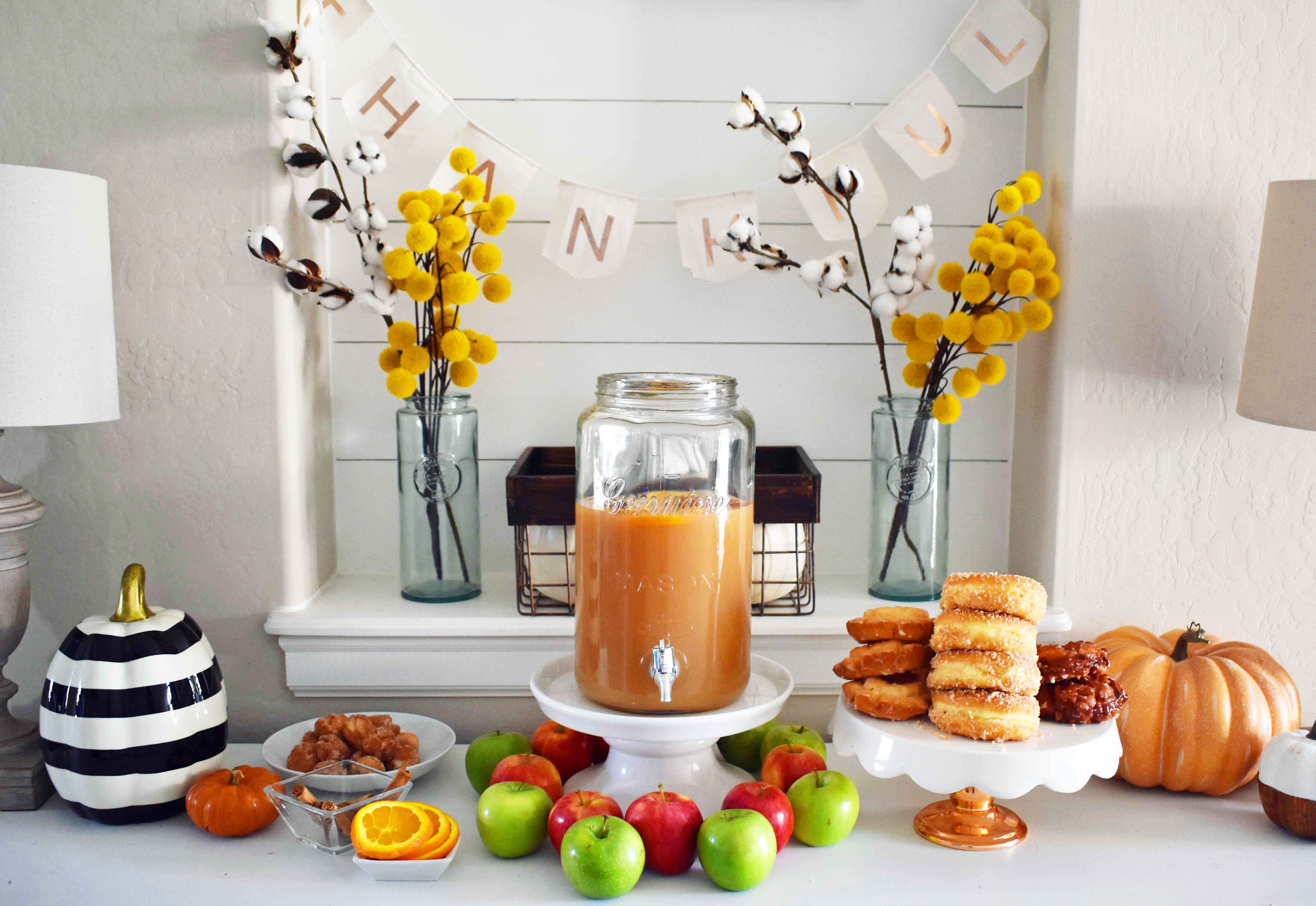 How to make a DIY Hot Apple Cider Bar to celebrate Fall. A simple, easy way to serve hot apple cider and a homemade apple fritters recipe. A hot apple cider bar with all of the toppings. www.modernhoney.com