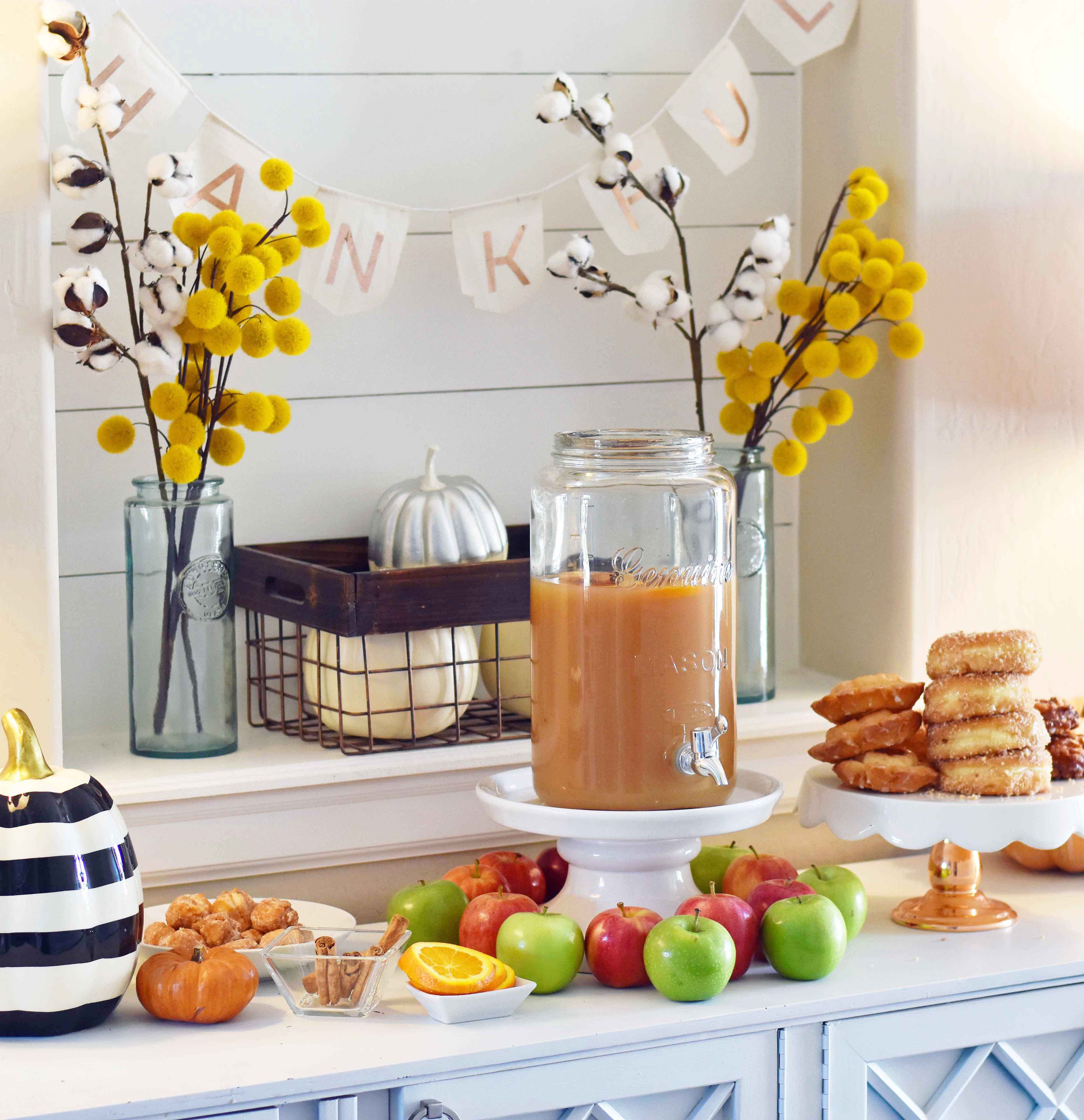 How to make a DIY Hot Apple Cider Bar to celebrate Fall. A simple, easy way to serve hot apple cider and a homemade apple fritters recipe. A hot apple cider bar with all of the toppings. www.modernhoney.com