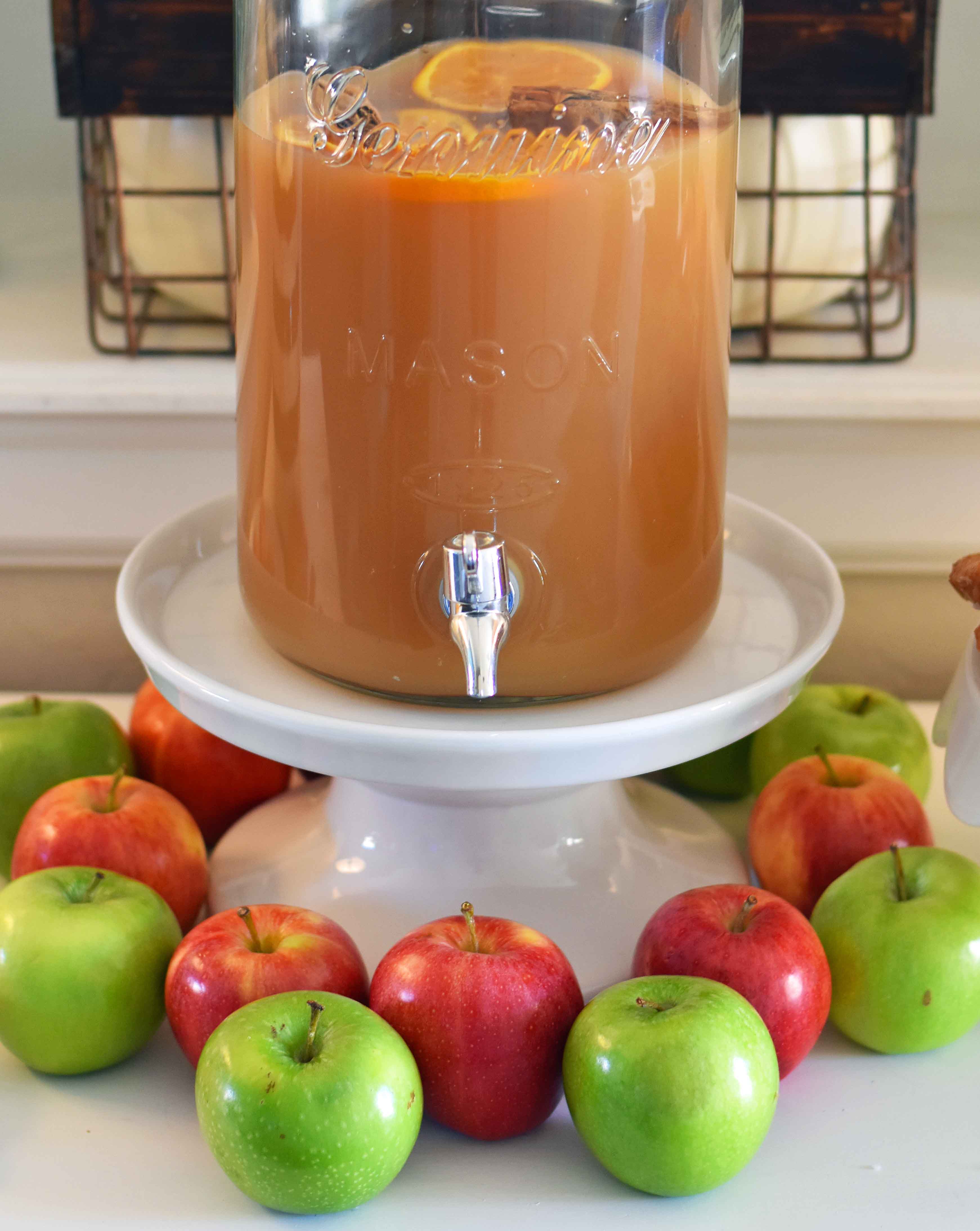How to make a DIY Hot Apple Cider Bar to celebrate Fall. A simple, easy way to serve hot apple cider and a homemade apple fritters recipe. A hot apple cider bar with all of the toppings. www.modernhoney.com