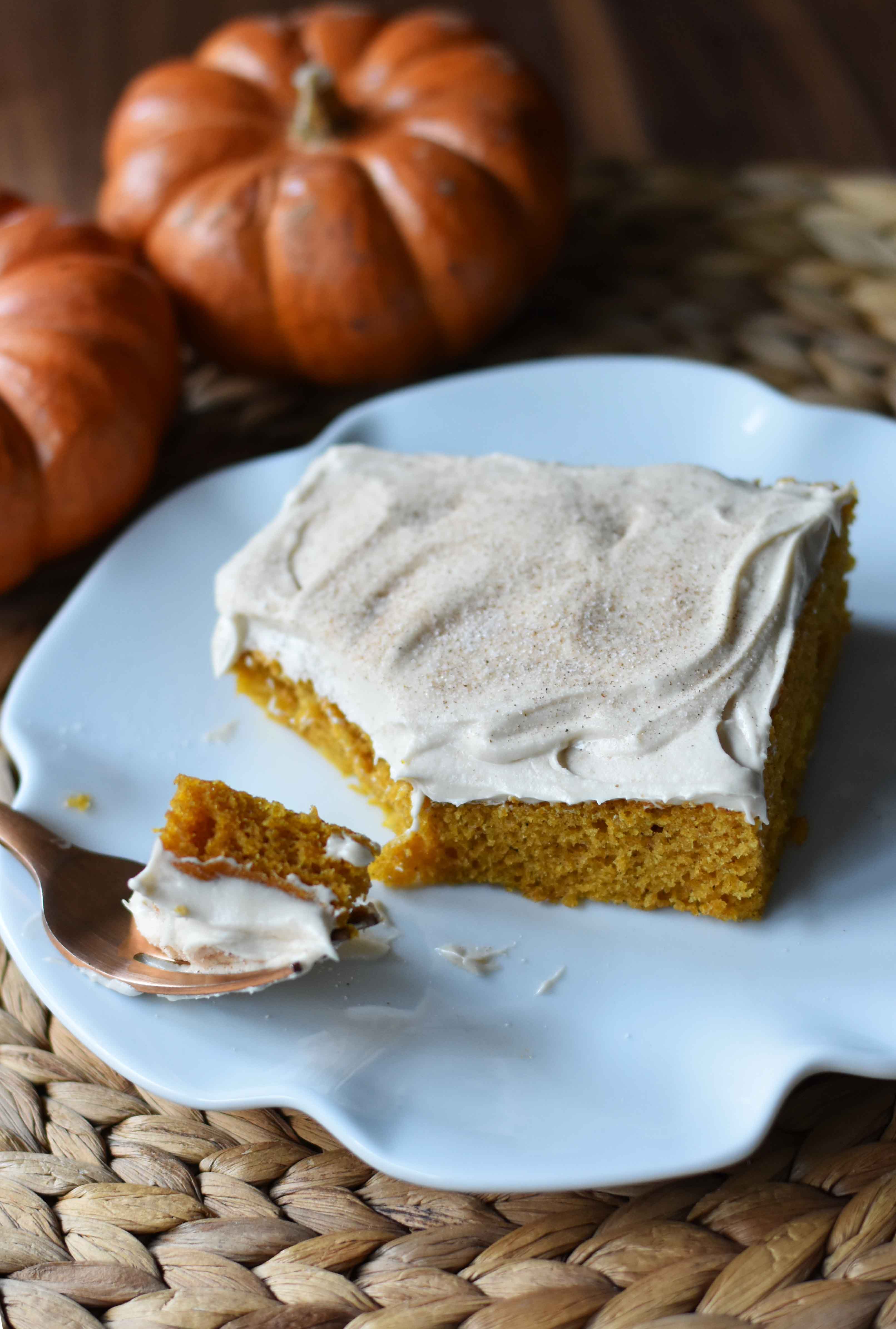 Pumpkin Sheet Cake with Cream Cheese Frosting. A pumpkin spice cake with a creamy homemade cream cheese frosting. A super simple, easy cake recipe! www.modernhoney.com