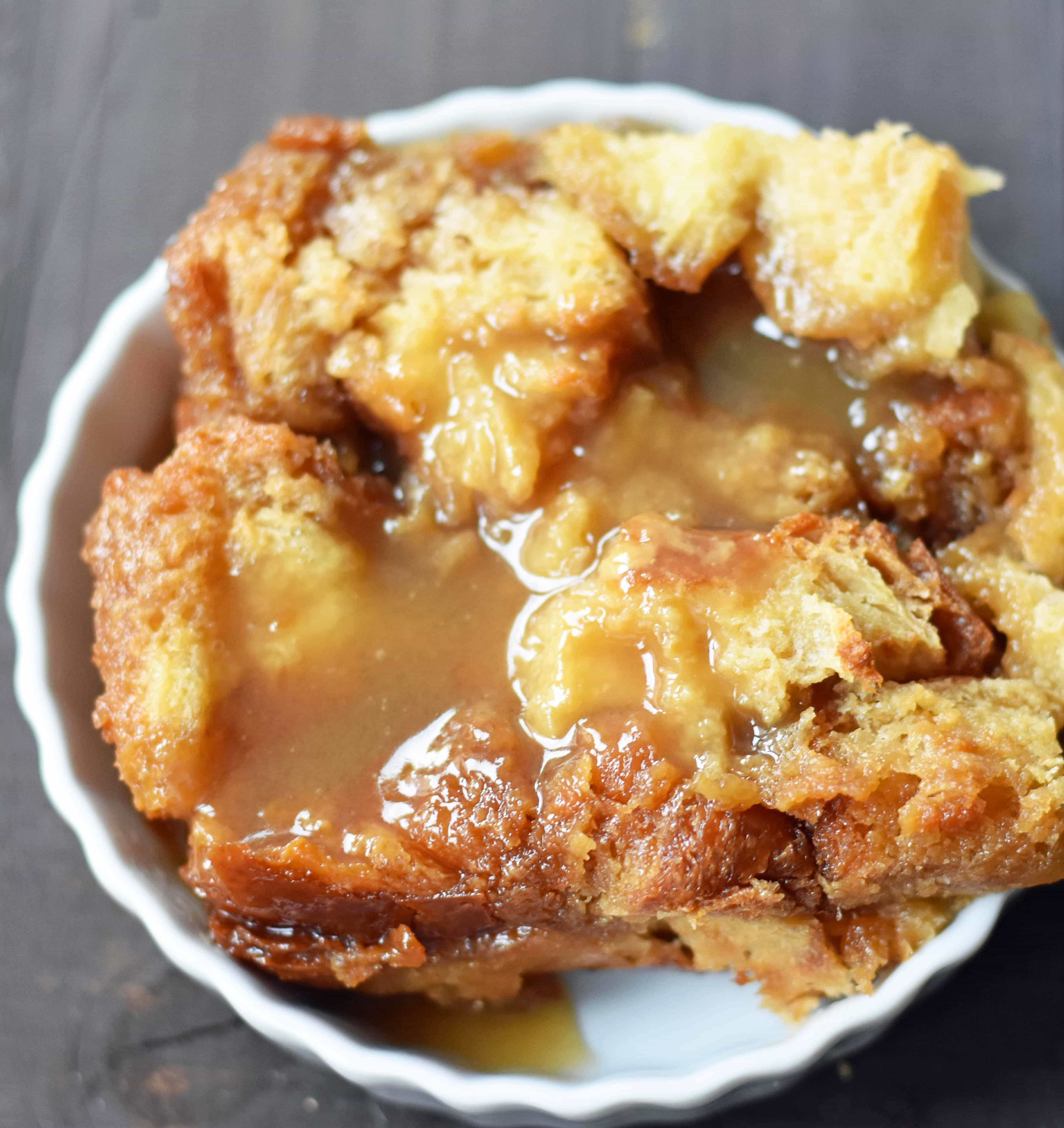 Salted Caramel Bread Pudding made with brioche or challah bread and baked in half-n-half, eggs, brown sugar, and vanilla. This heavenly caramel bread pudding is topped with a homemade sea salt caramel sauce. www.modernhoney.com