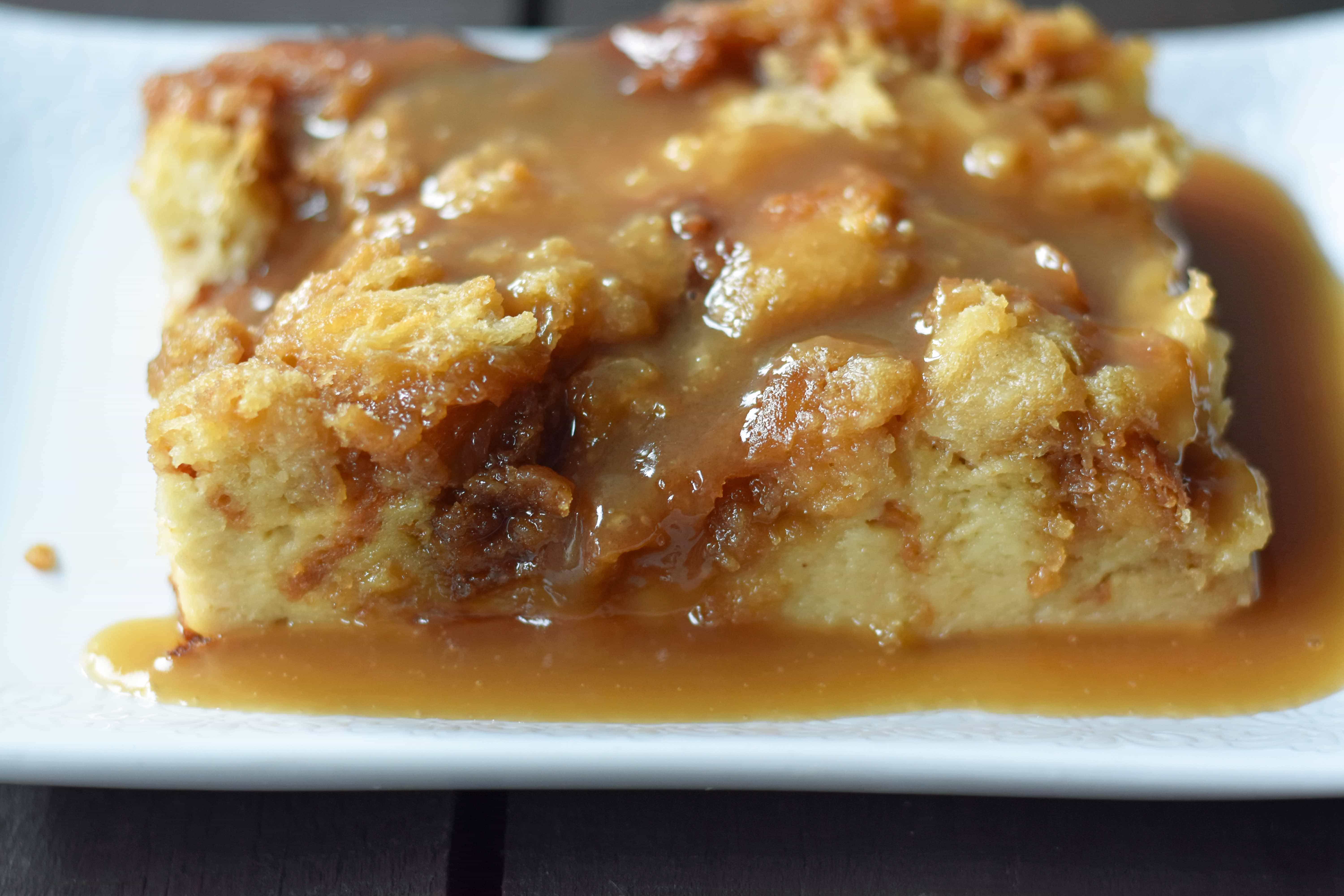 Salted Caramel Bread Pudding made with brioche or challah bread and baked in half-n-half, eggs, brown sugar, and vanilla. This heavenly caramel bread pudding is topped with a homemade sea salt caramel sauce. www.modernhoney.com