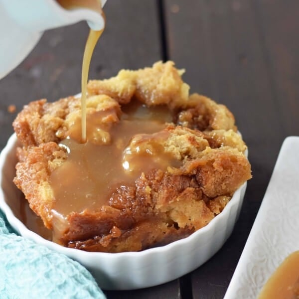 Salted Caramel Bread Pudding made with brioche or challah bread and baked in half-n-half, eggs, brown sugar, and vanilla. This heavenly caramel bread pudding is topped with a homemade sea salt caramel sauce. www.modernhoney.com