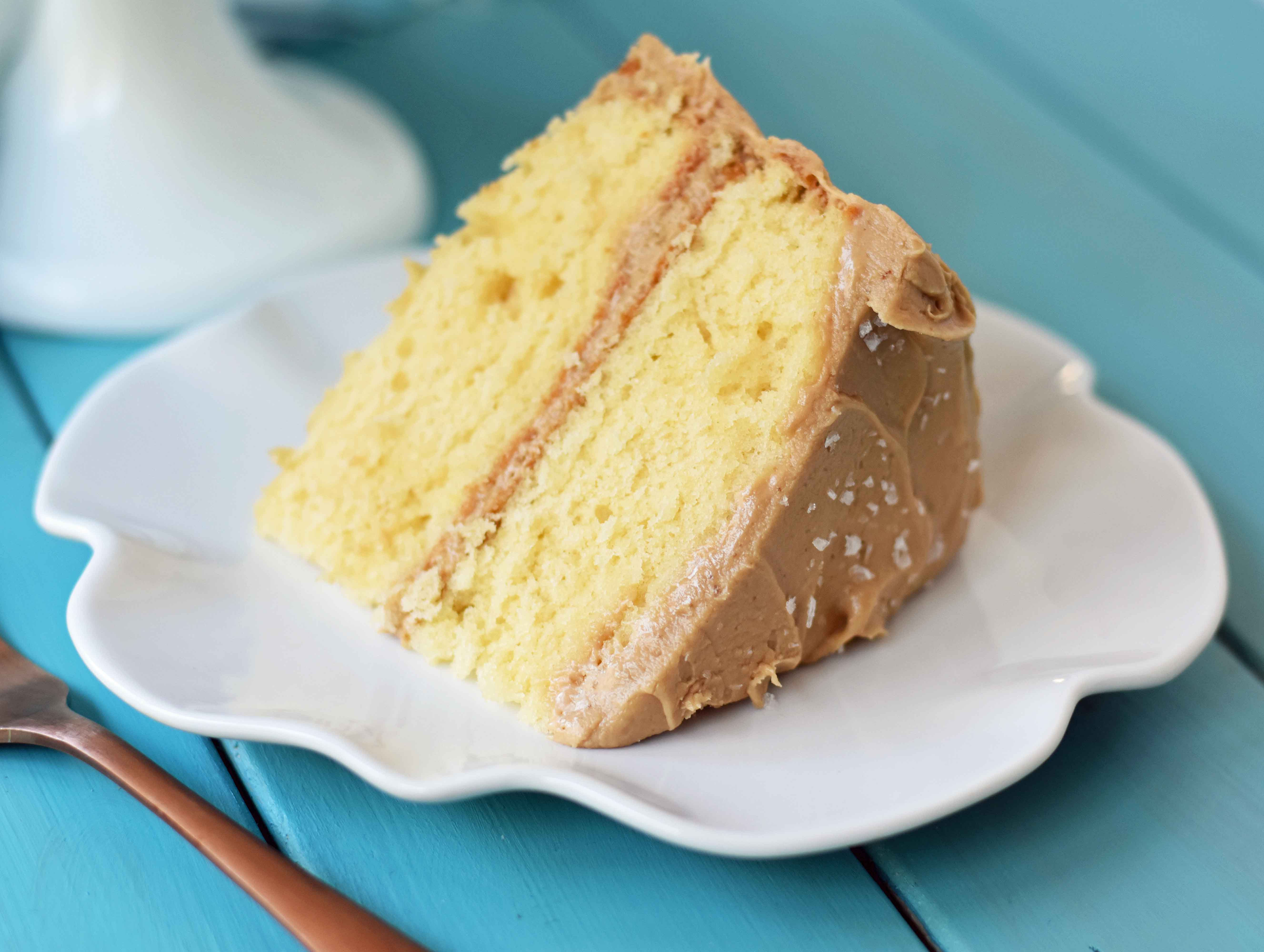 Southern Caramel Cake with Salted Caramel Frosting. A moist and fluffy yellow cake with sea salt caramel frosting. A Southern favorite cake! www.modernhoney.com