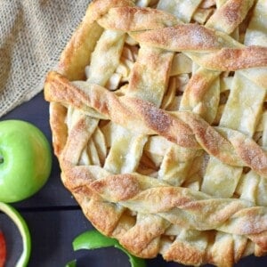 Caramel Apple Pie is a made with sweet and crisp apples sauteed in brown sugar and drizzled with homemade caramel sauce, all in a buttery flaky pie crust. The BEST Apple Pie Recipe drizzled with salted caramel sauce. www.modernhoney.com