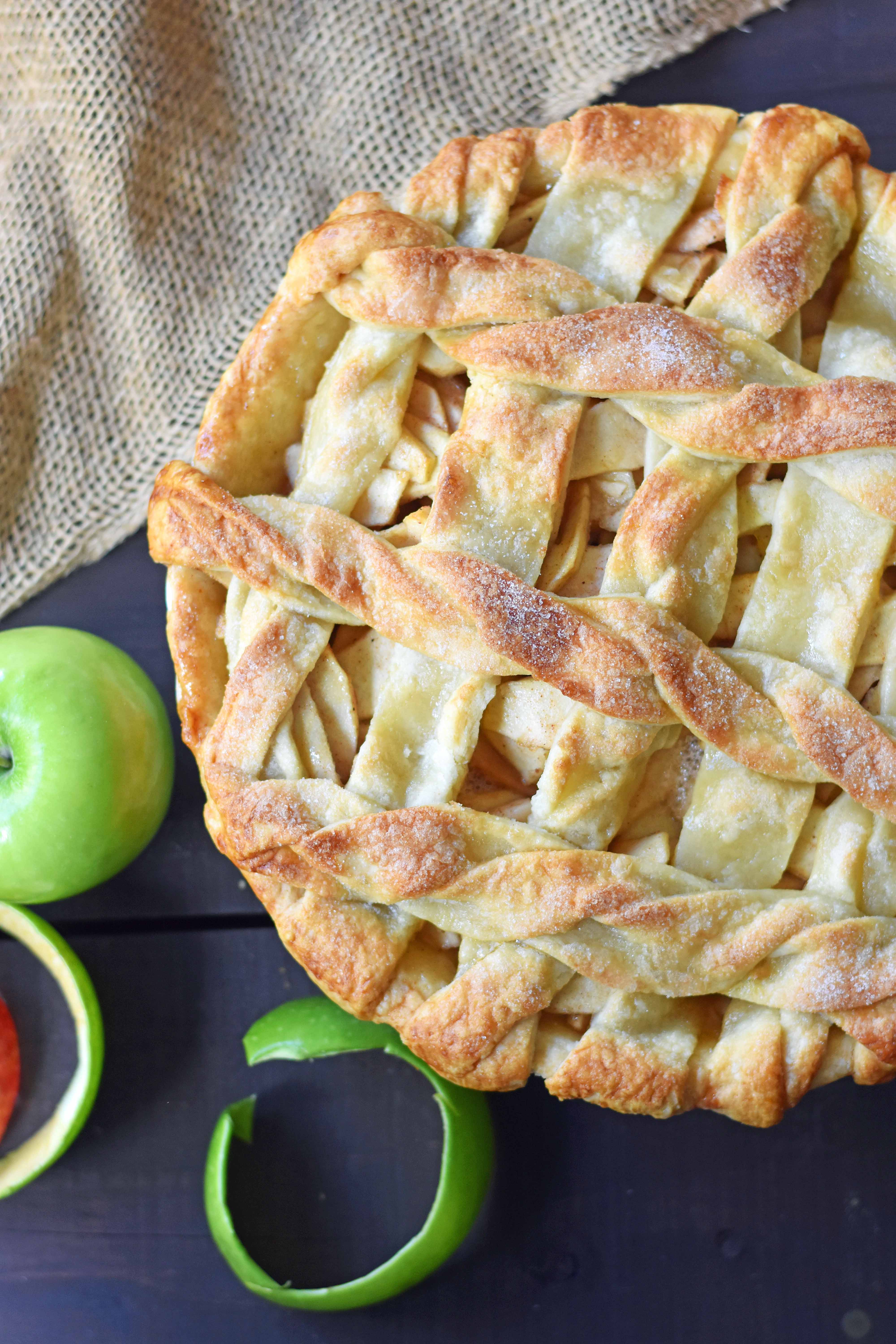 Caramel Apple Pie is a made with sweet and crisp apples sauteed in brown sugar and drizzled with homemade caramel sauce, all in a buttery flaky pie crust. The BEST Apple Pie Recipe drizzled with salted caramel sauce. www.modernhoney.com