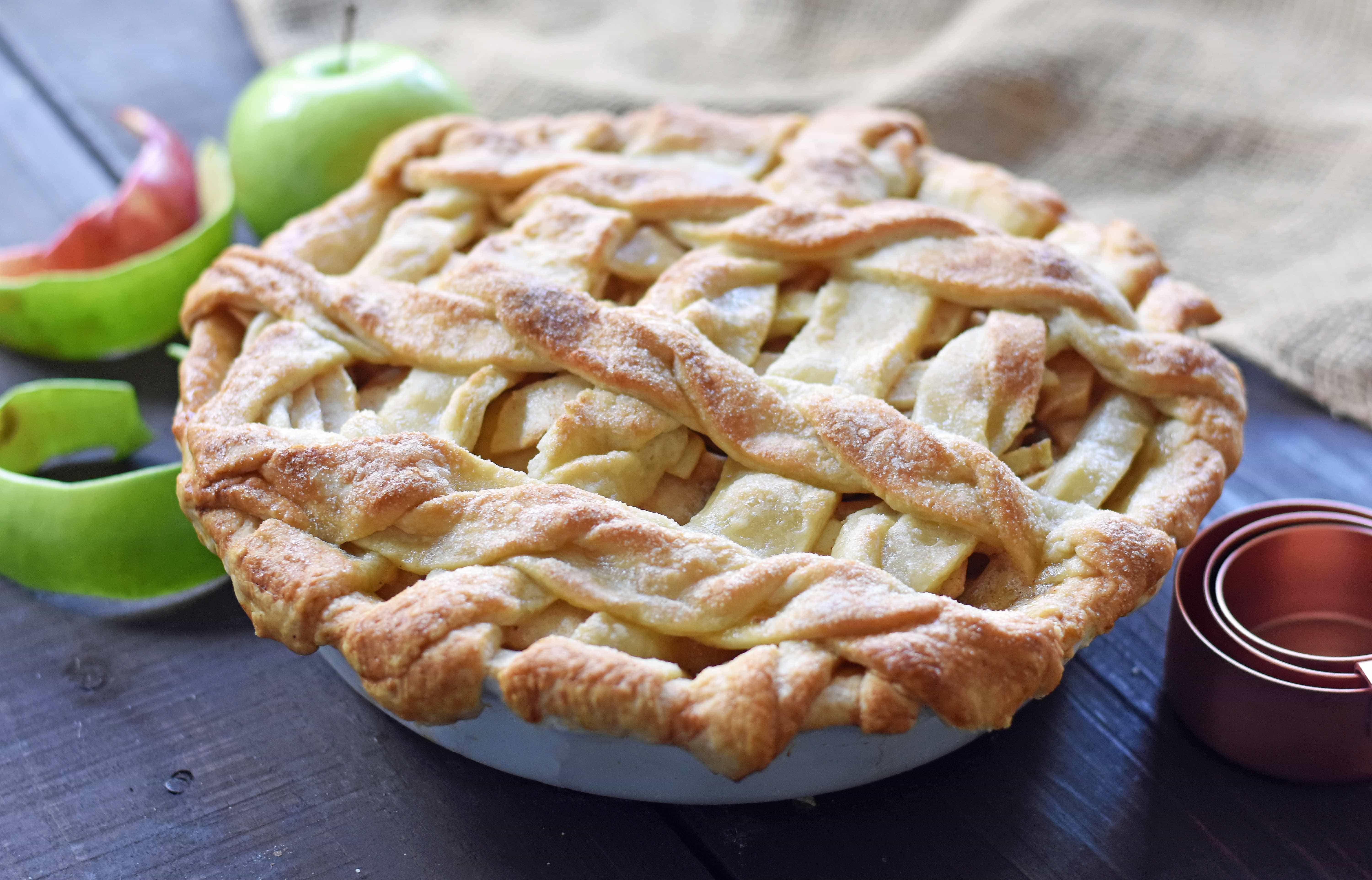 Caramel Apple Pie is a made with sweet and crisp apples sauteed in brown sugar and drizzled with homemade caramel sauce, all in a buttery flaky pie crust. The BEST Apple Pie Recipe drizzled with salted caramel sauce. www.modernhoney.com