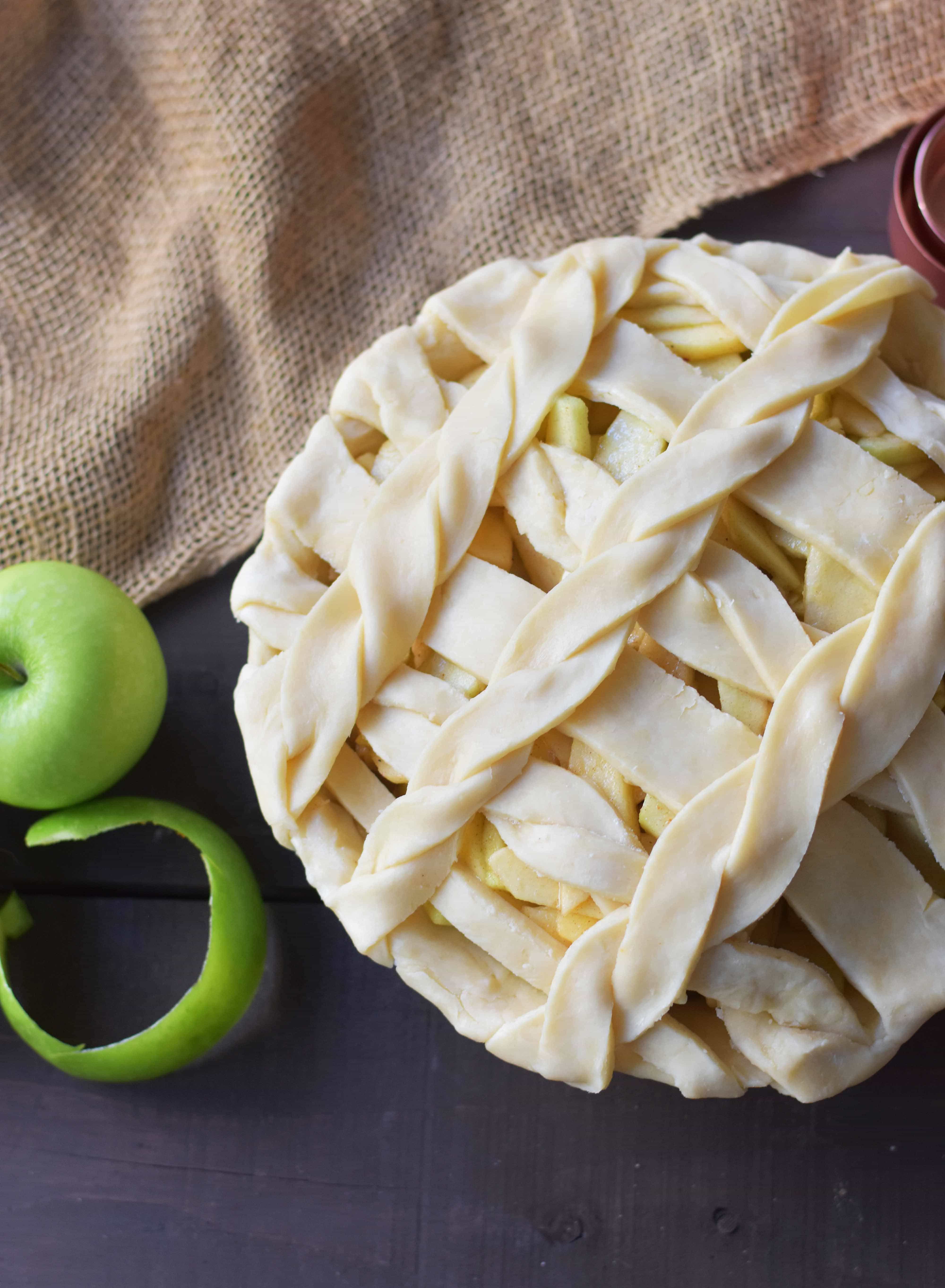 Caramel Apple Pie is a made with sweet and crisp apples sauteed in brown sugar and drizzled with homemade caramel sauce, all in a buttery flaky pie crust. The BEST Apple Pie Recipe drizzled with salted caramel sauce. www.modernhoney.com