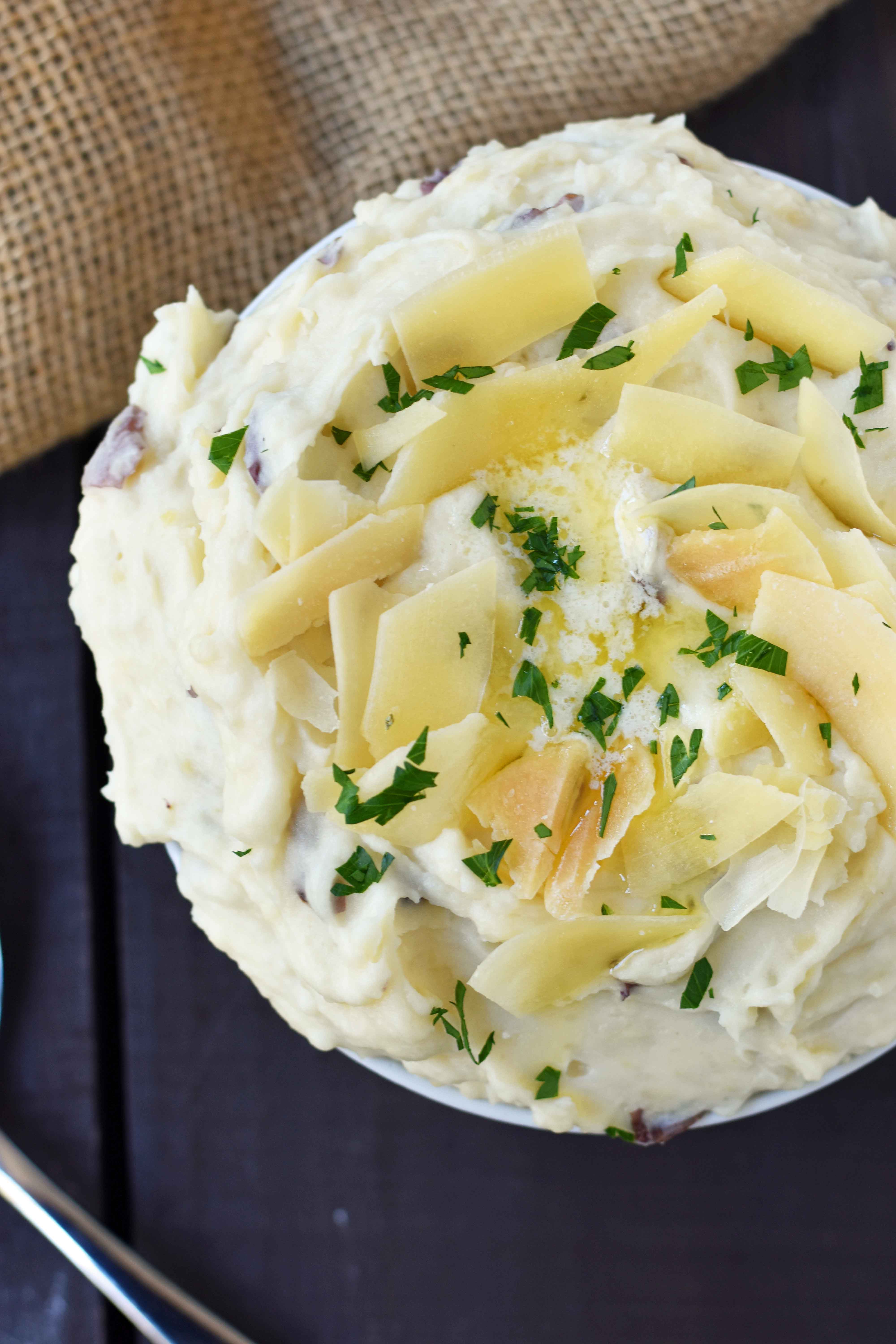 Creamy Parmesan Mashed Potatoes are the perfect mashed potatoes. Rich and creamy potatoes with butter, half-n-half, sour cream, and parmesan cheese. The most flavorful and creamy mashed potatoes! A popular side dish. www.modernhoney.com