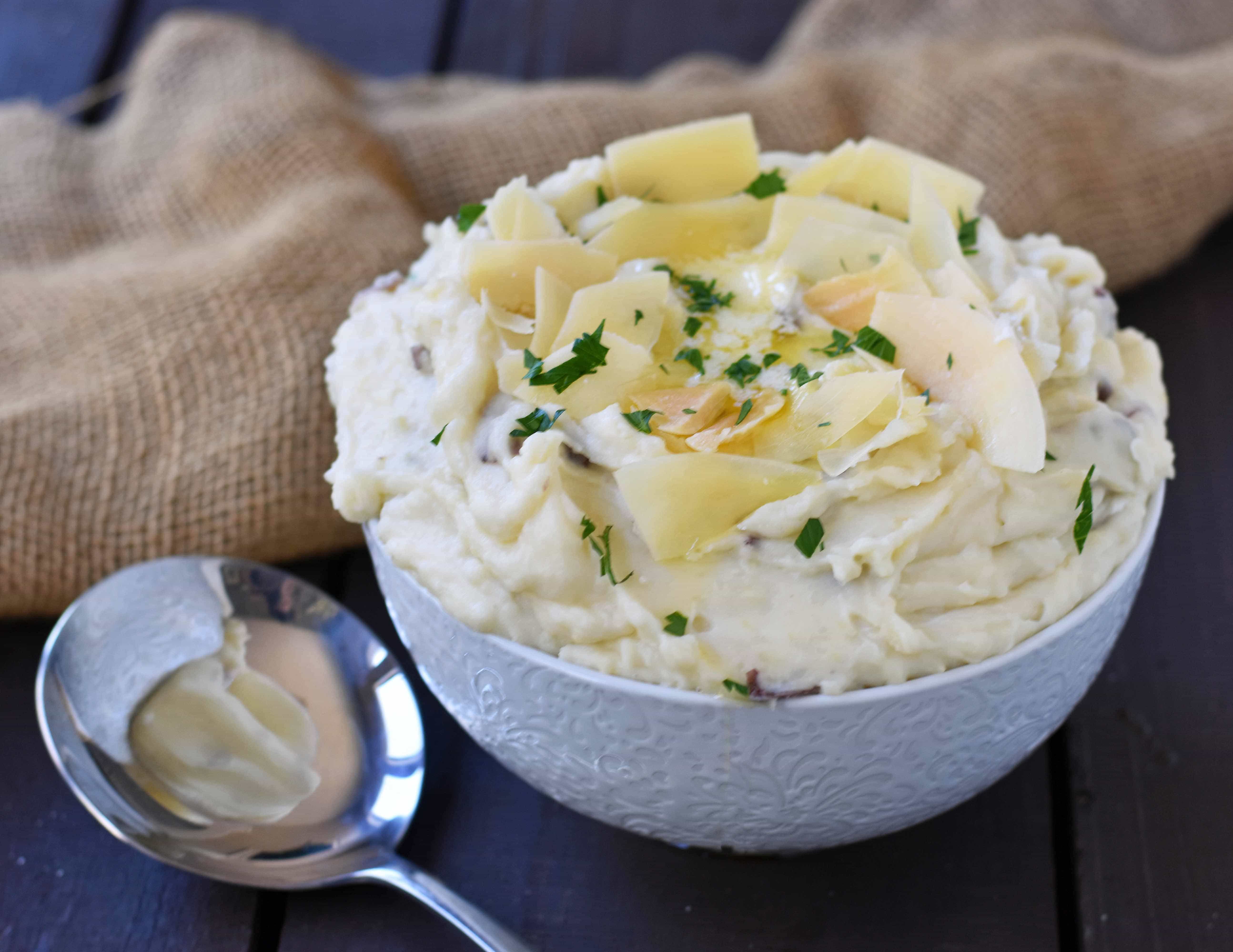 Creamy Parmesan Mashed Potatoes are the perfect mashed potatoes. Rich and creamy potatoes with butter, half-n-half, sour cream, and parmesan cheese. The most flavorful and creamy mashed potatoes! A popular side dish. www.modernhoney.com