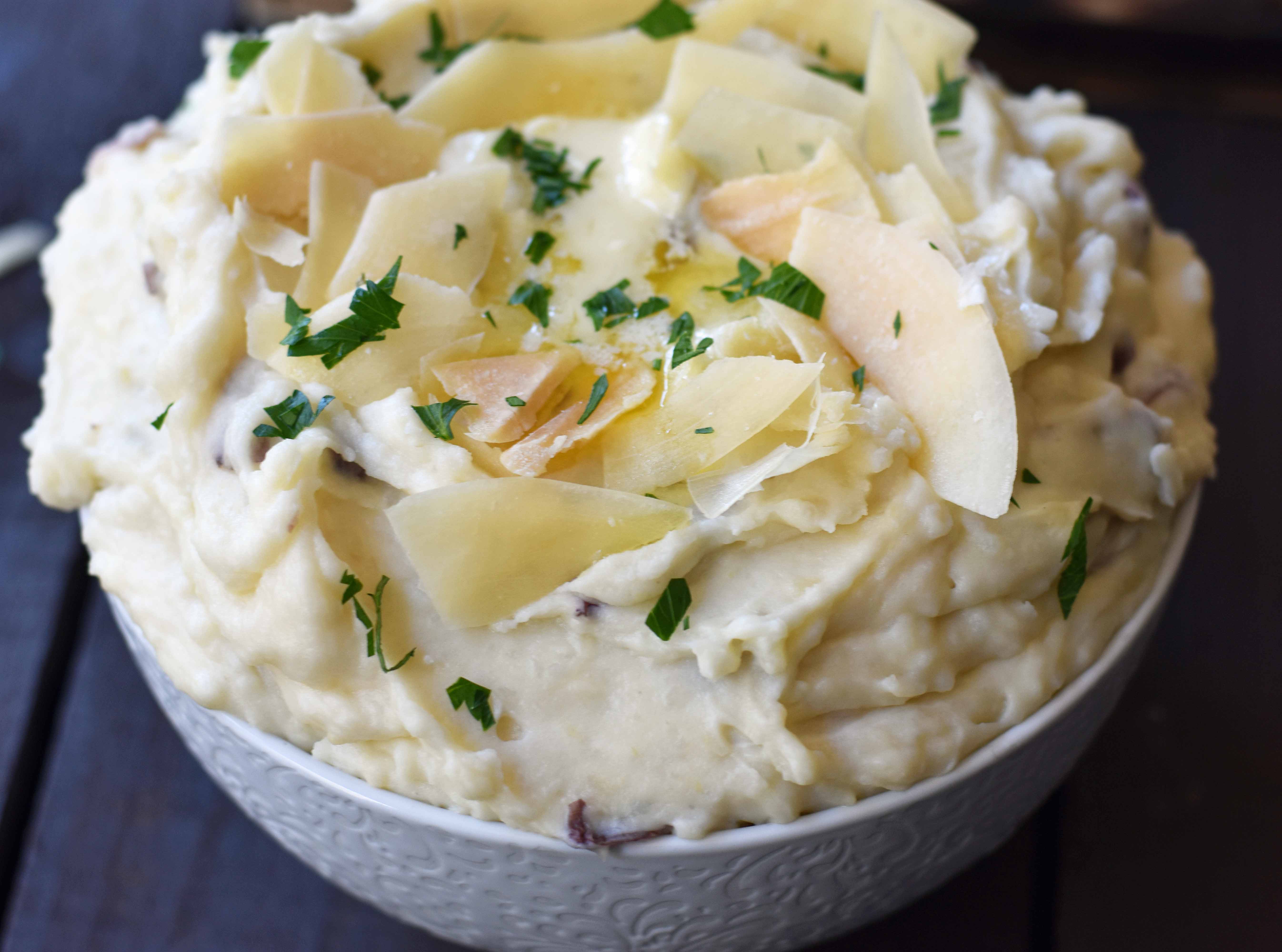 Creamy Parmesan Mashed Potatoes are the perfect mashed potatoes. Rich and creamy potatoes with butter, half-n-half, sour cream, and parmesan cheese. The most flavorful and creamy mashed potatoes! A popular side dish. www.modernhoney.com