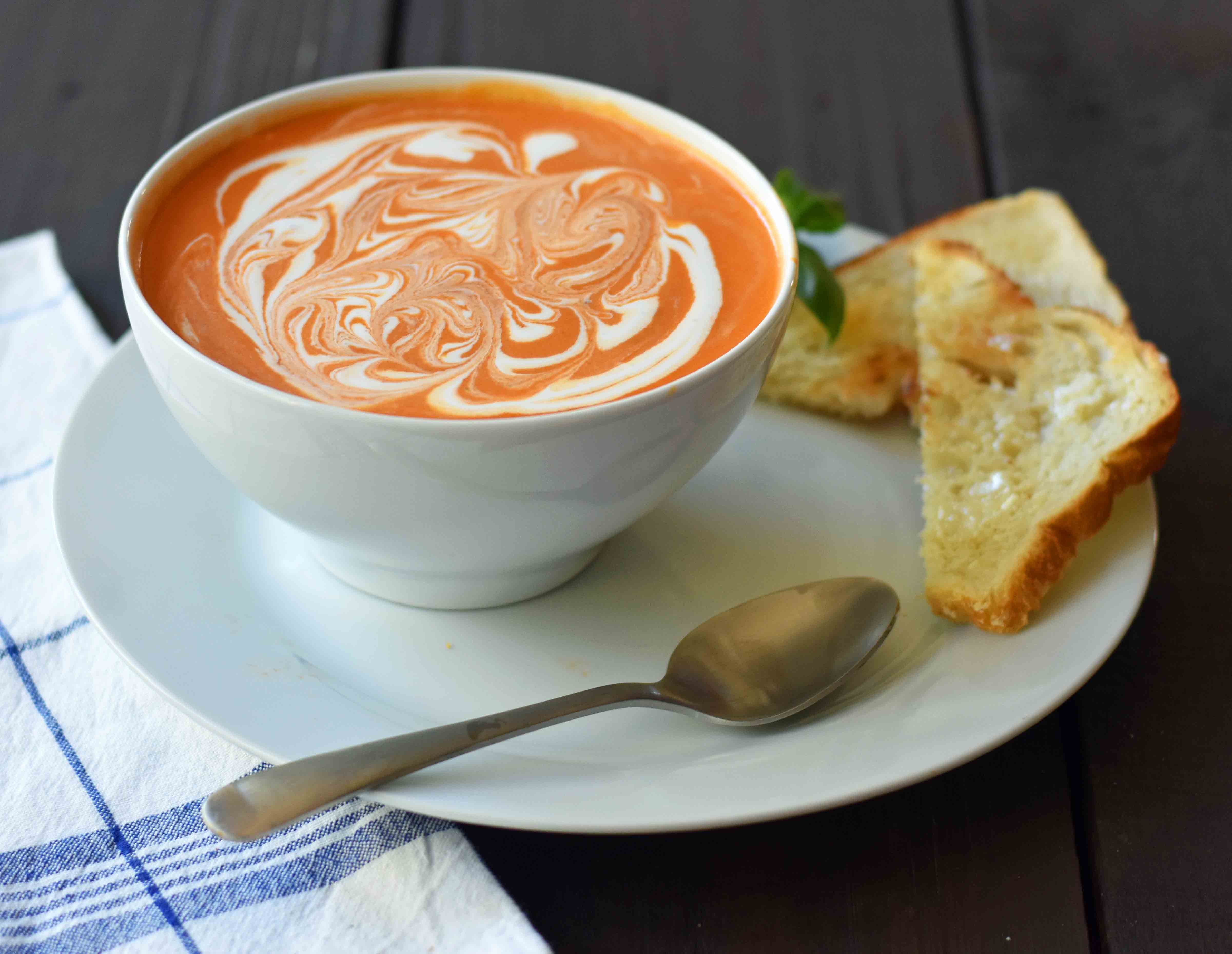 Creamy Tomato Basil Soup is the best cream of tomato soup. This Creamy Tomato Basil Soup Recipe using sauteed onions, garlic, tomatoes, chicken broth, basil, and heavy cream. You will never eat canned tomato soup again! The best creamy tomato soup recipe. www.modernhoney.com