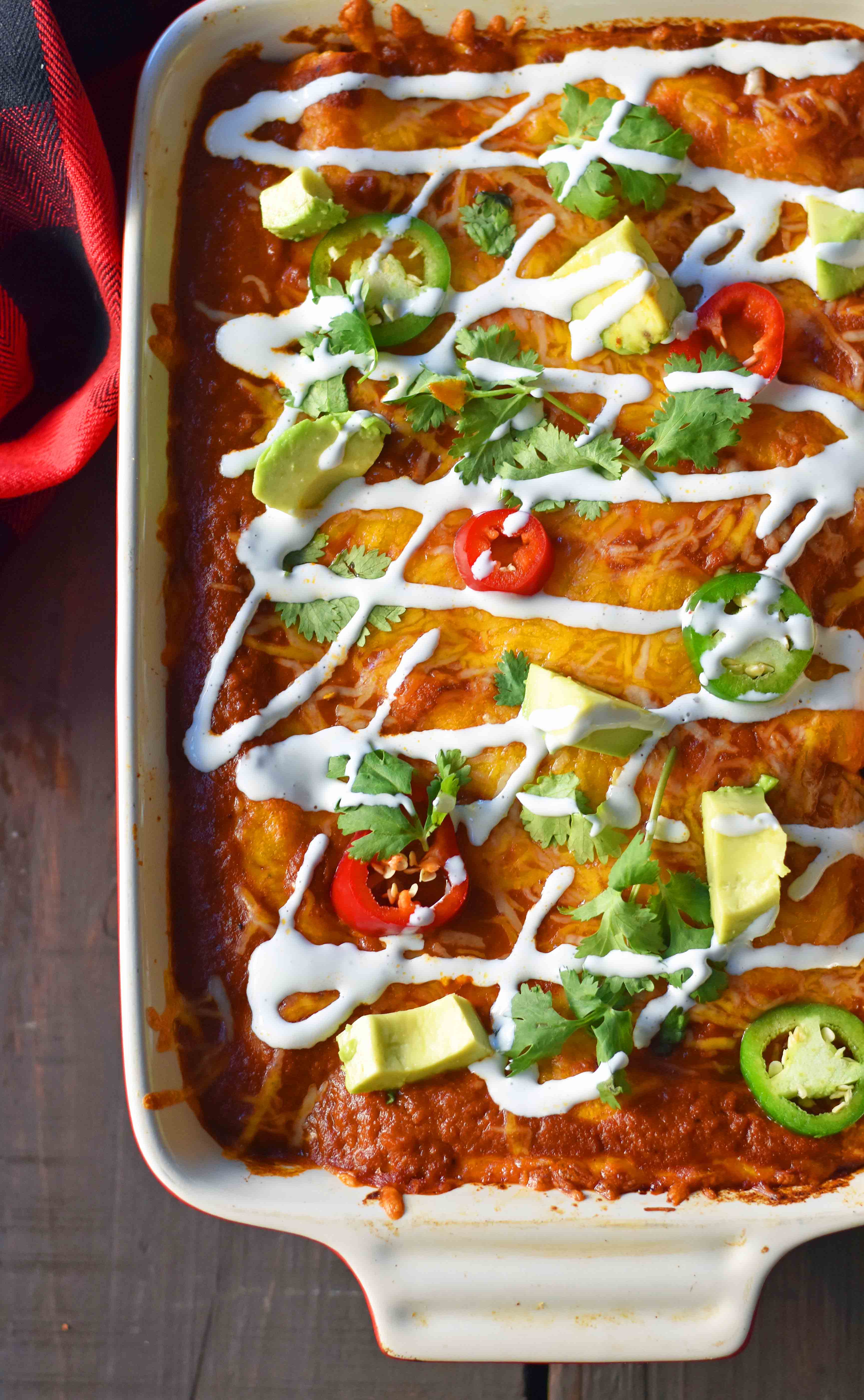 Red Chile Chicken Enchiladas with homemade red enchilada sauce. How to make enchilada sauce from scratch. The best red chicken and cheese enchiladas. www.modernhoney.com