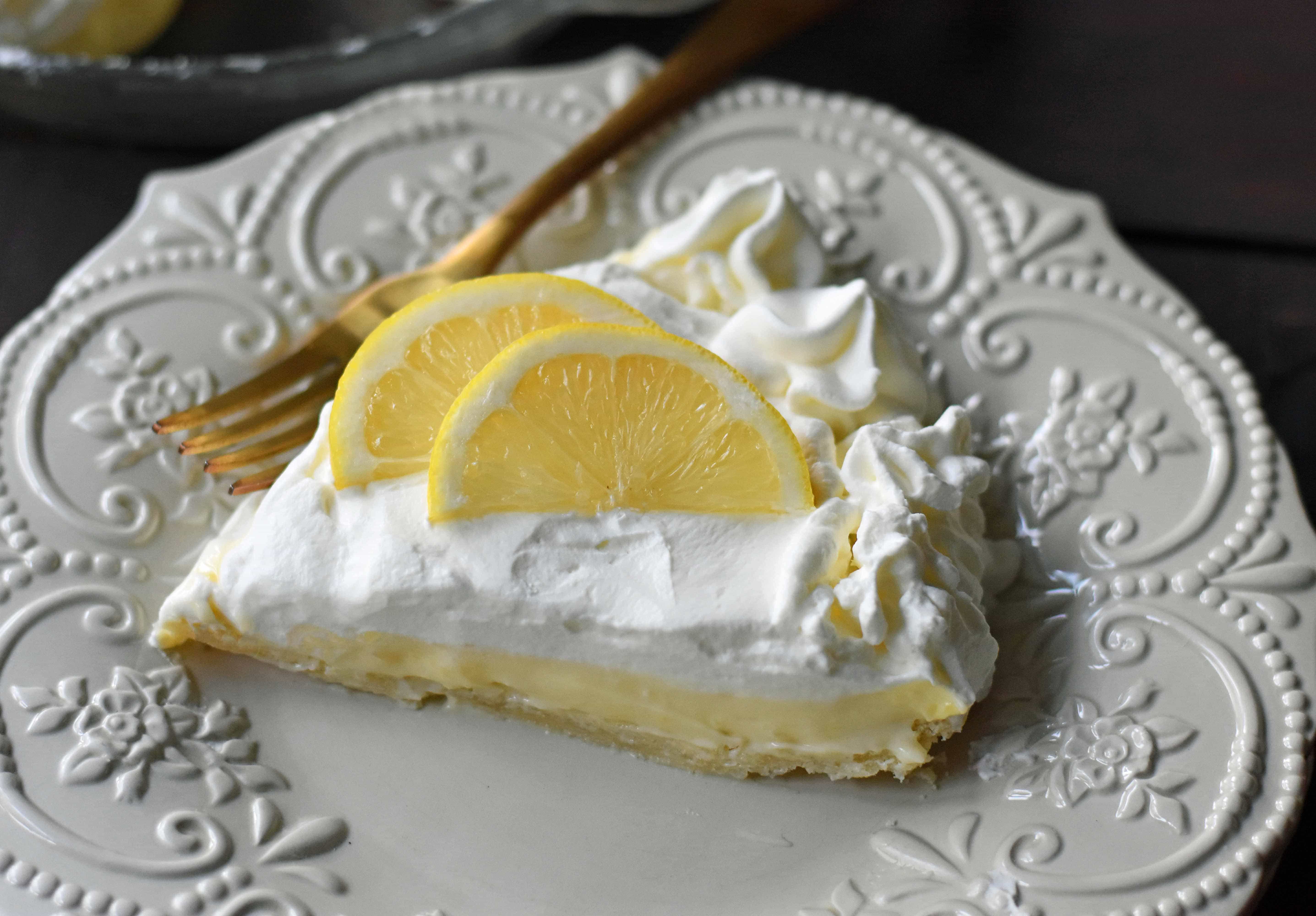 Sweet Lemon Sour Cream Pie made with freshly squeezed lemon juice, sugar, eggs, and sour cream to make it rich and creamy. All topped with homemade whipped cream in a buttery, flaky crust. A Marie Callender's Sour Cream Lemon Pie Copycat Recipe. www.modernhoney.com