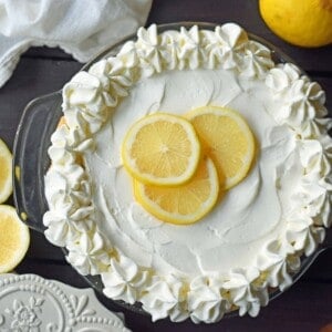 Sweet Lemon Sour Cream Pie made with freshly squeezed lemon juice, sugar, eggs, and sour cream to make it rich and creamy. All topped with homemade whipped cream in a buttery, flaky crust. A Marie Callender's Sour Cream Lemon Pie Copycat Recipe. www.modernhoney.com