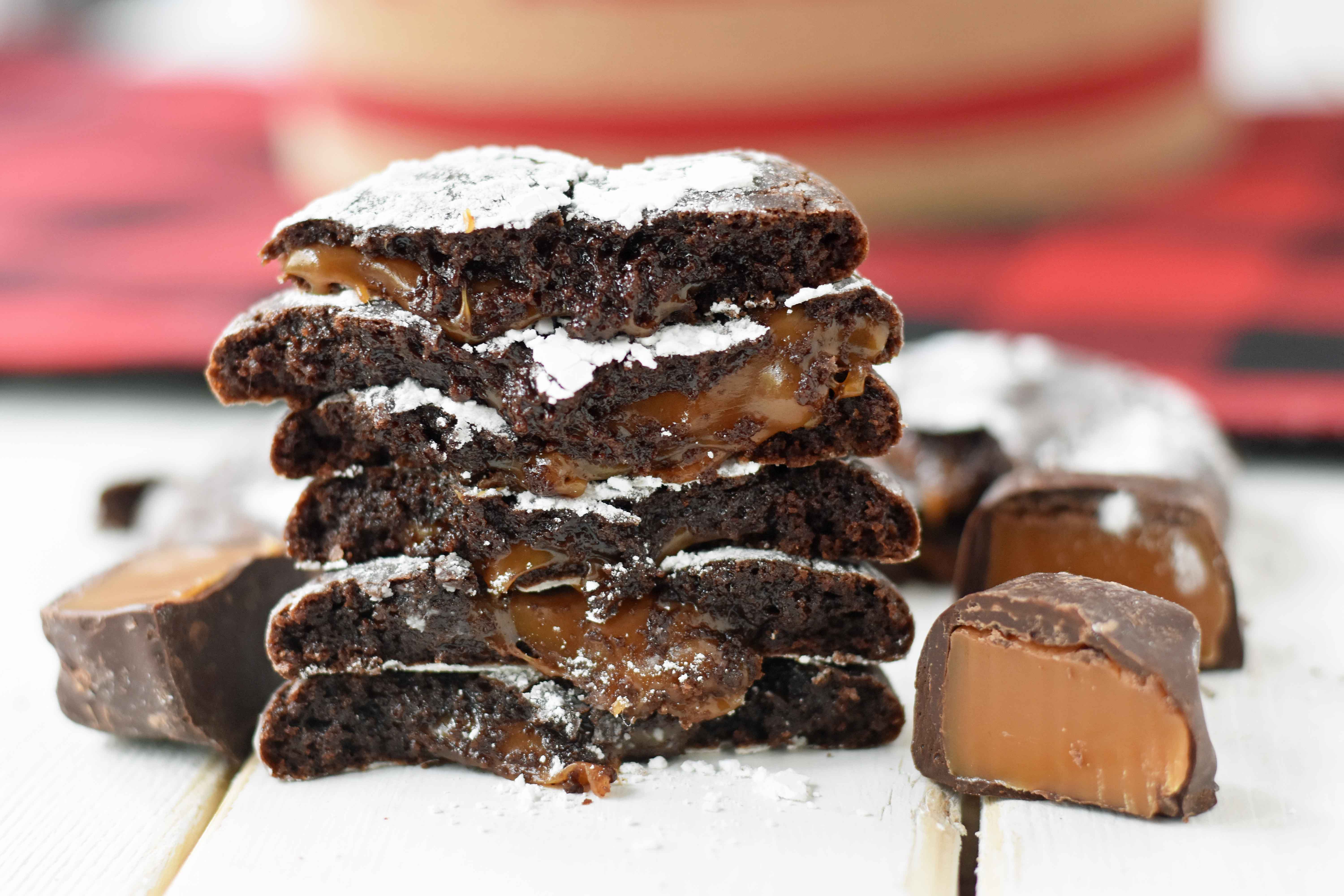 Caramel Filled Chocolate Crinkle Cookies. Soft chewy chocolate cookies with soft caramel center and roll into powdered sugar. A popular chocolate caramel filled cookie. www.modernhoney.com