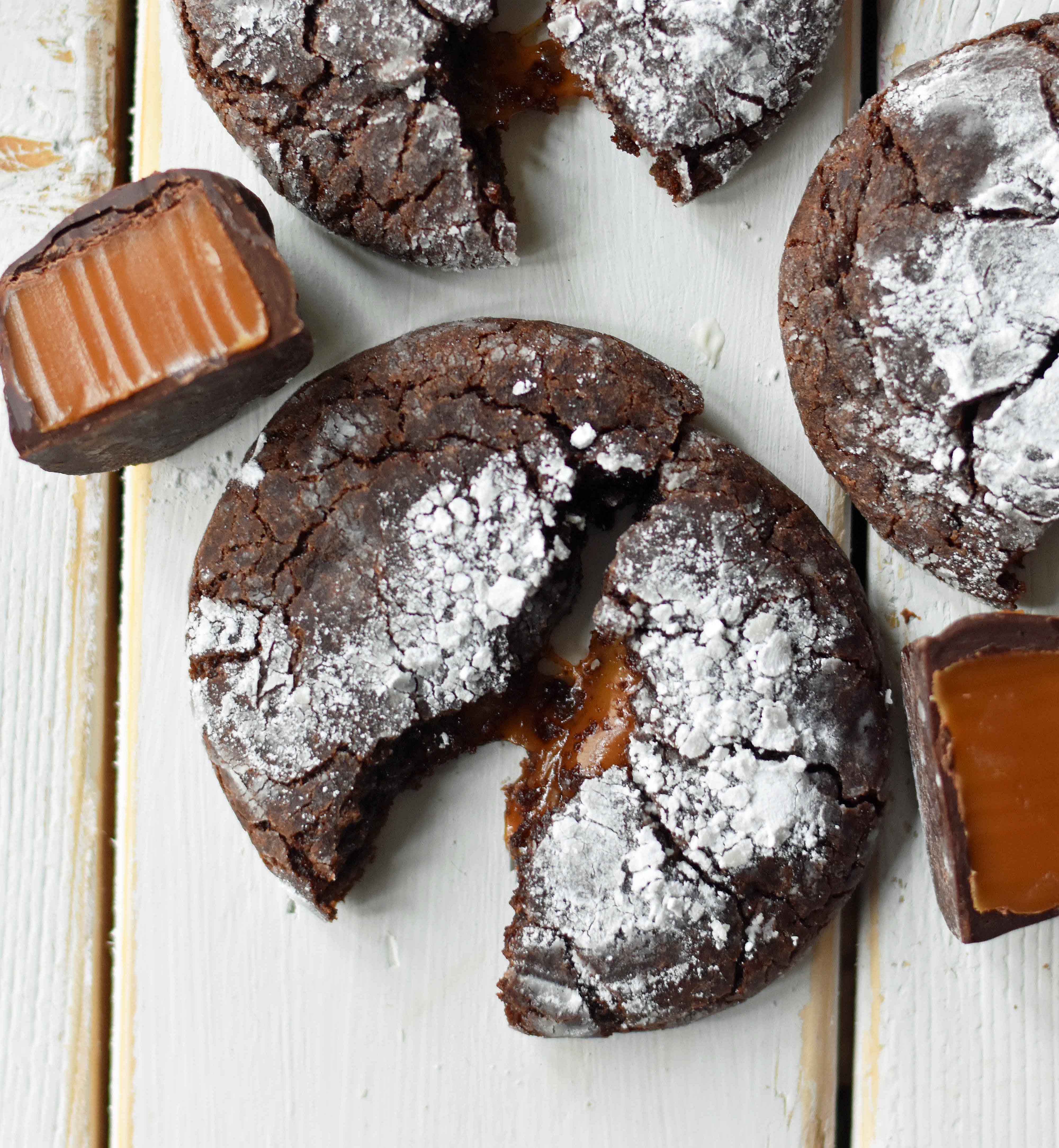 Caramel Filled Chocolate Crinkle Cookies. Soft chewy chocolate cookies with soft caramel center and roll into powdered sugar. A popular chocolate caramel filled cookie. www.modernhoney.com