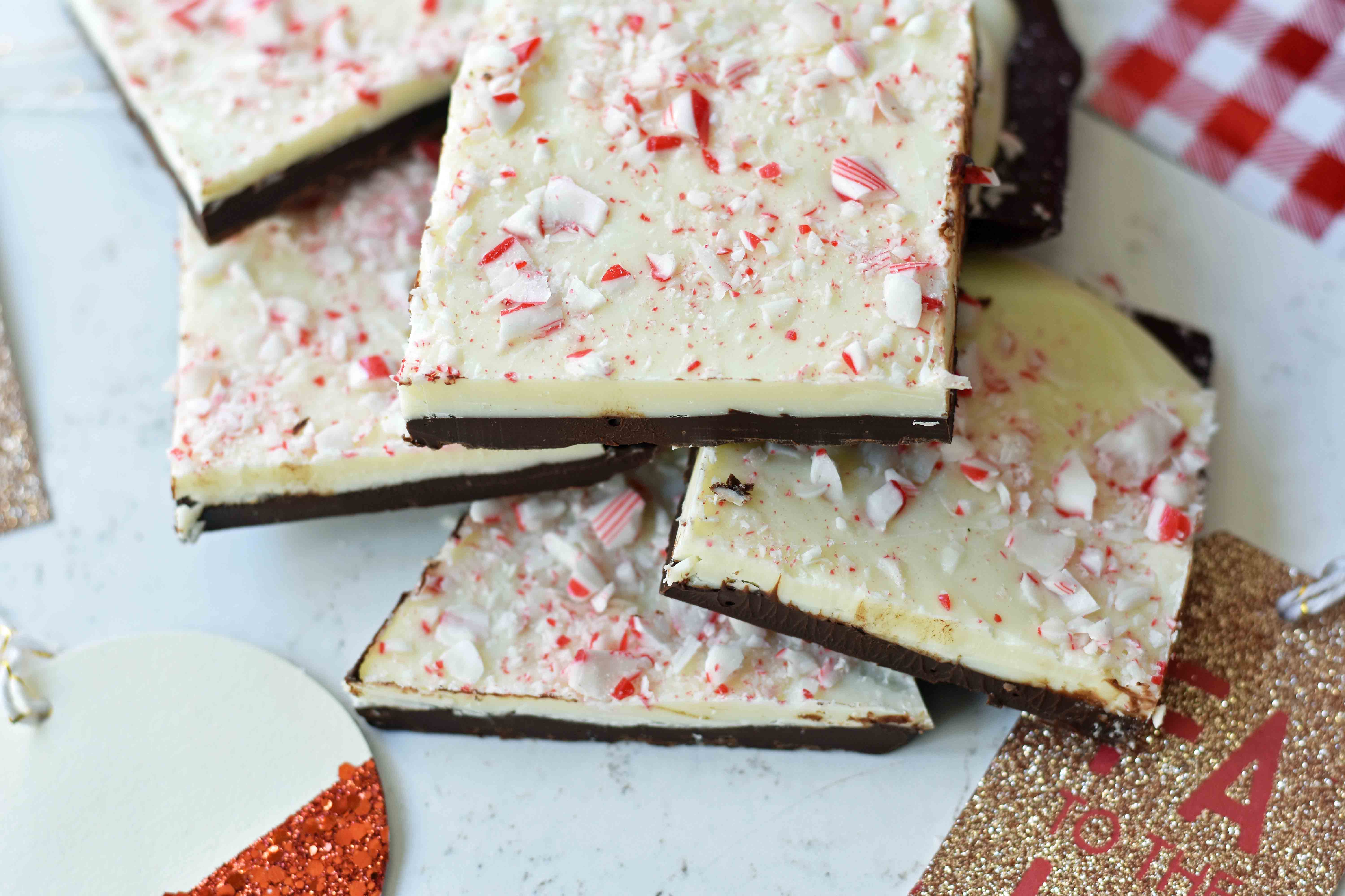 Chocolate Peppermint Bark made with layers of melted white chocolate with a touch of peppermint, melted chocolate, and topped with crushed peppermint candy canes. This is the BEST Peppermint Bark Recipe! www.modernhoney.com