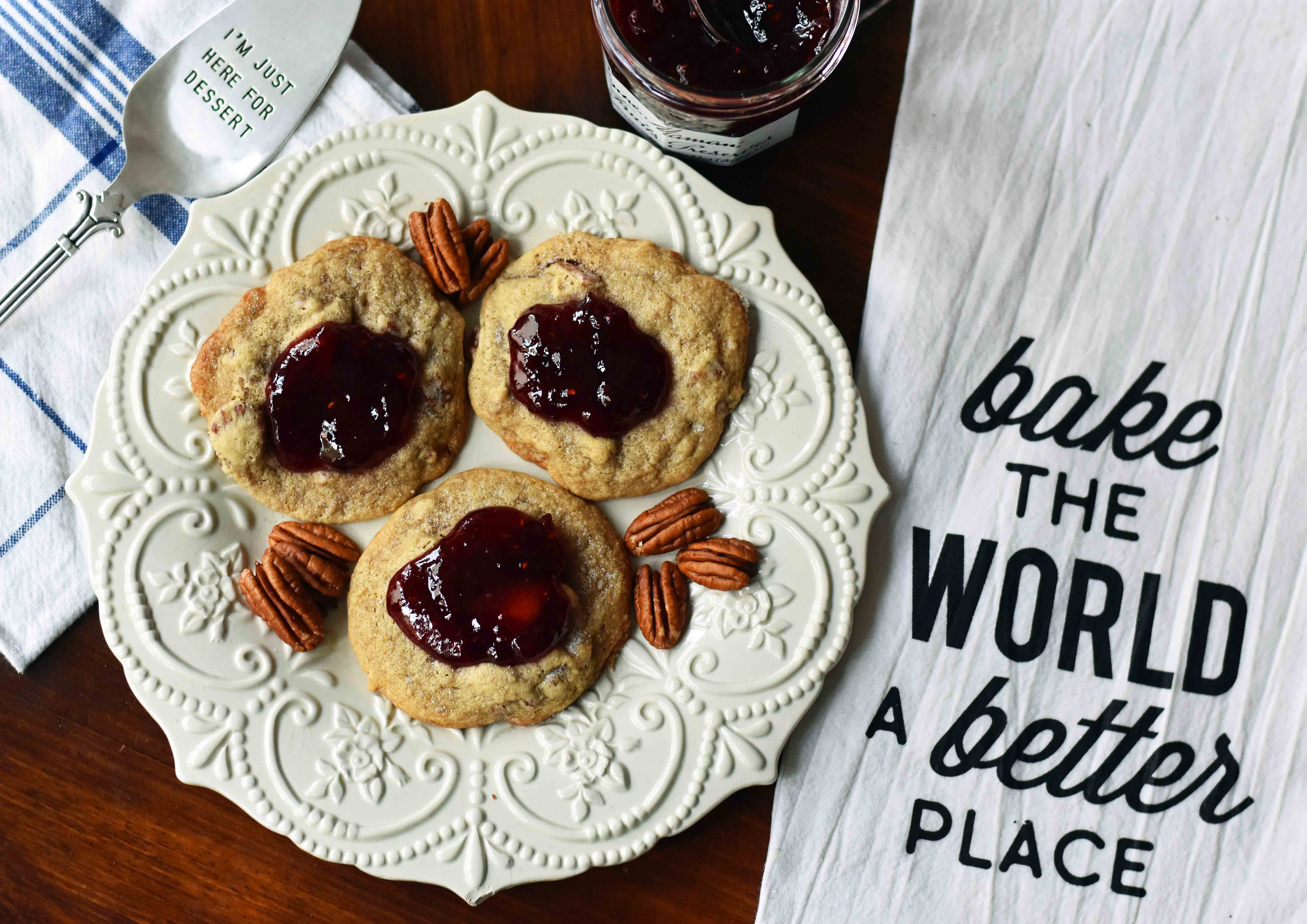 Cream Cheese Pecan Jam Thumbprint Cookies are a chewy pecan cookie baked until golden and topped with fresh berry jam. A soft and chewy cream cheese pecan cookie topped with fresh jam. www.modernhoney.com