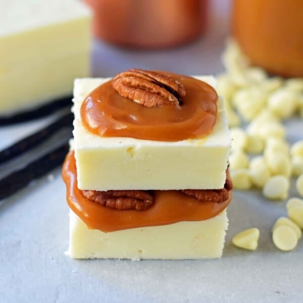 Creamy White Vanilla Fudge. Secrets, tips, and tricks for making perfect white vanilla white chocolate fudge every single time. Two secret ingredients that make this creamy white vanilla fudge the BEST fudge ever. www.modernhoney.com