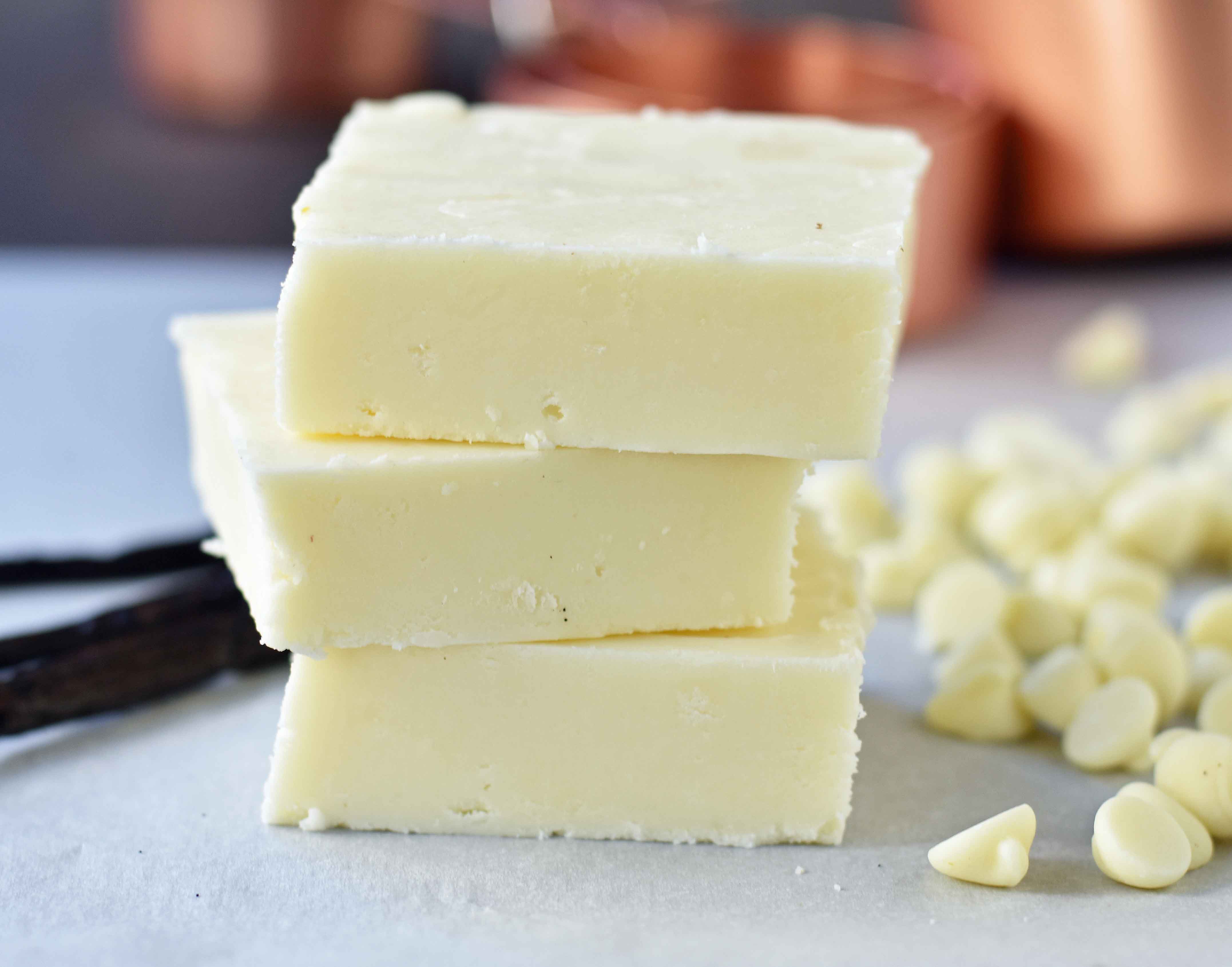 Creamy White Vanilla Fudge. Secrets, tips, and tricks for making perfect white vanilla white chocolate fudge every single time. Two secret ingredients that make this creamy white vanilla fudge the BEST fudge ever. www.modernhoney.com