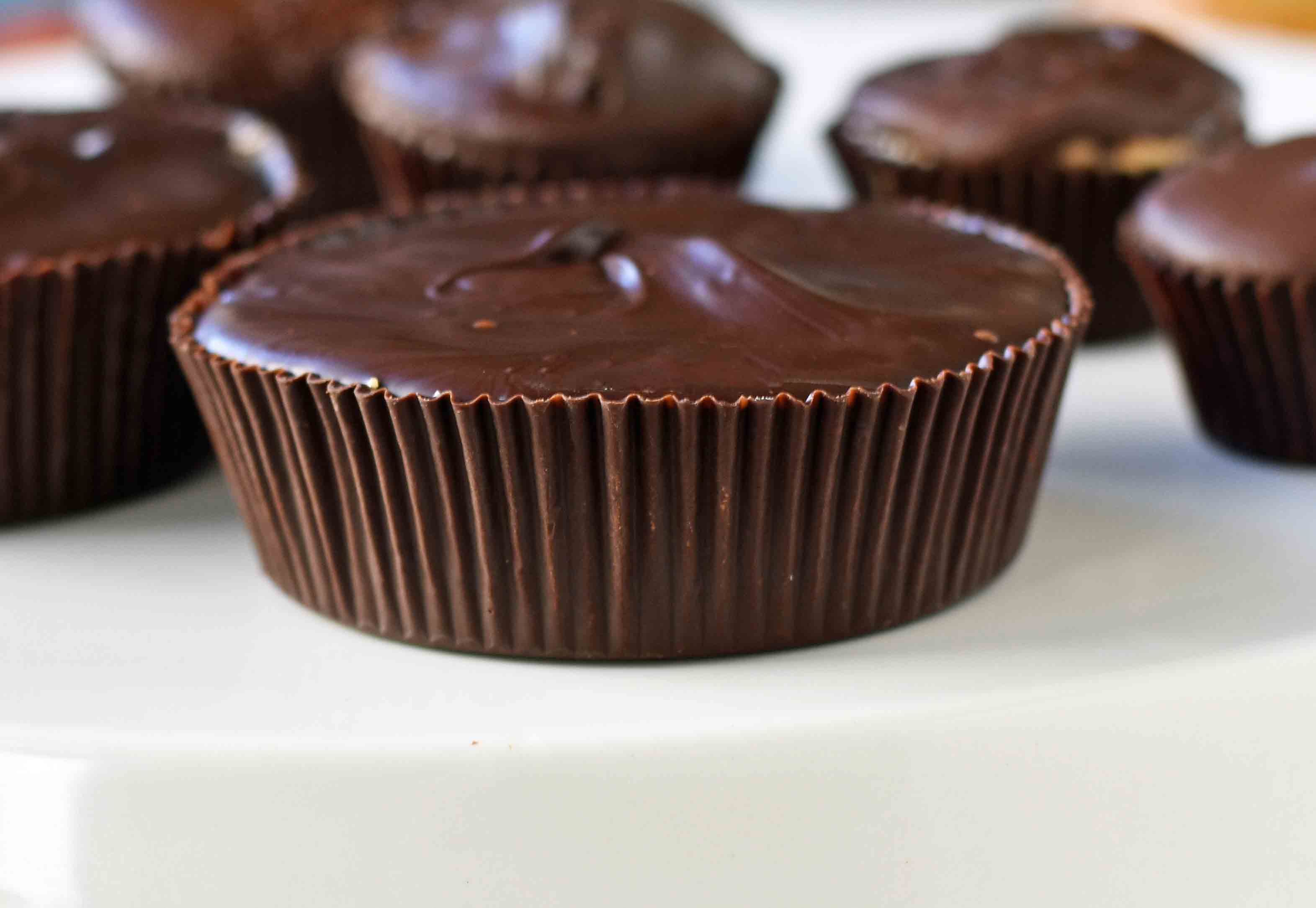 Homemade Chocolate Peanut Butter Cups. How to make copycat Reese's chocolate chip peanut butter cups and copycat Trader Joe's peanut butter cups. The best homemade chocolate peanut butter cups recipe. www.modernhoney.com