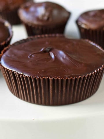 Homemade Chocolate Peanut Butter Cups. How to make copycat Reese's chocolate chip peanut butter cups and copycat Trader Joe's peanut butter cups. The best homemade chocolate peanut butter cups recipe. www.modernhoney.com