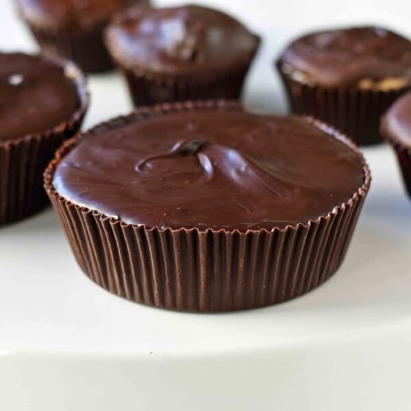 Homemade Chocolate Peanut Butter Cups. How to make copycat Reese's chocolate chip peanut butter cups and copycat Trader Joe's peanut butter cups. The best homemade chocolate peanut butter cups recipe. www.modernhoney.com