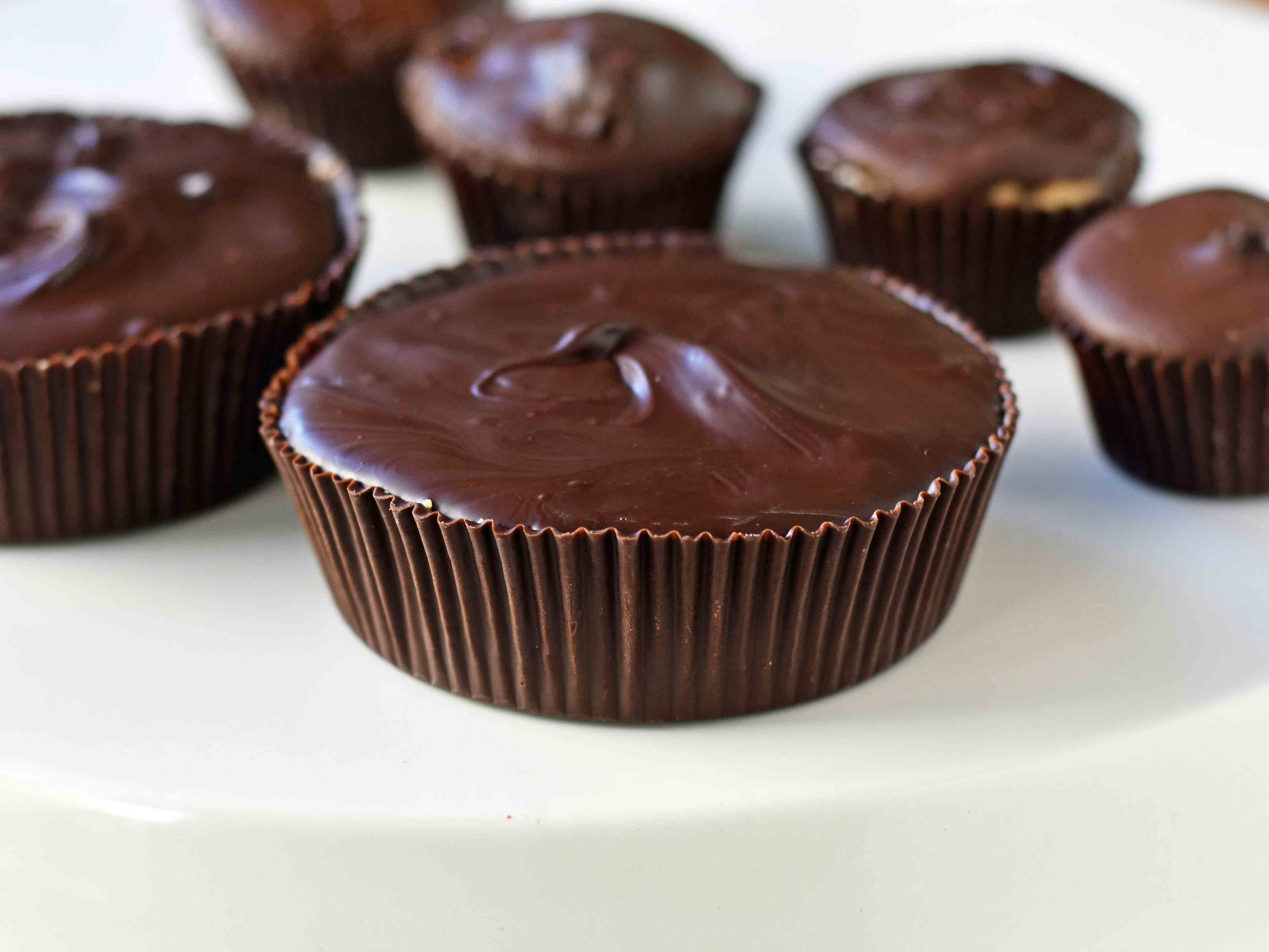 Homemade Chocolate Peanut Butter Cups. How to make copycat Reese's chocolate chip peanut butter cups and copycat Trader Joe's peanut butter cups. The best homemade chocolate peanut butter cups recipe. www.modernhoney.com