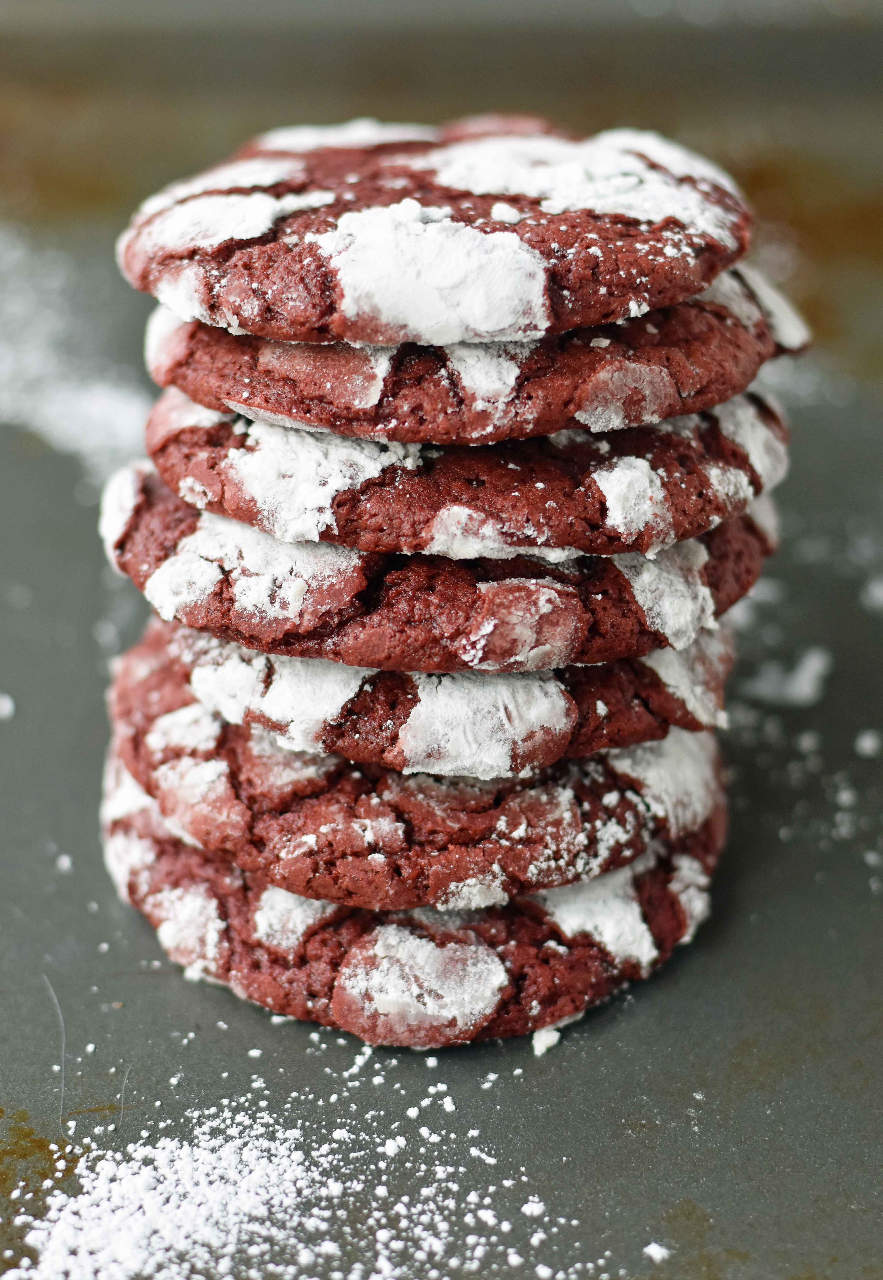 Red Velvet Crinkle Cookies are a mild chocolate soft chewy cookie covered in powdered sugar. A beautifully festive Christmas cookie. www.modernhoney.com