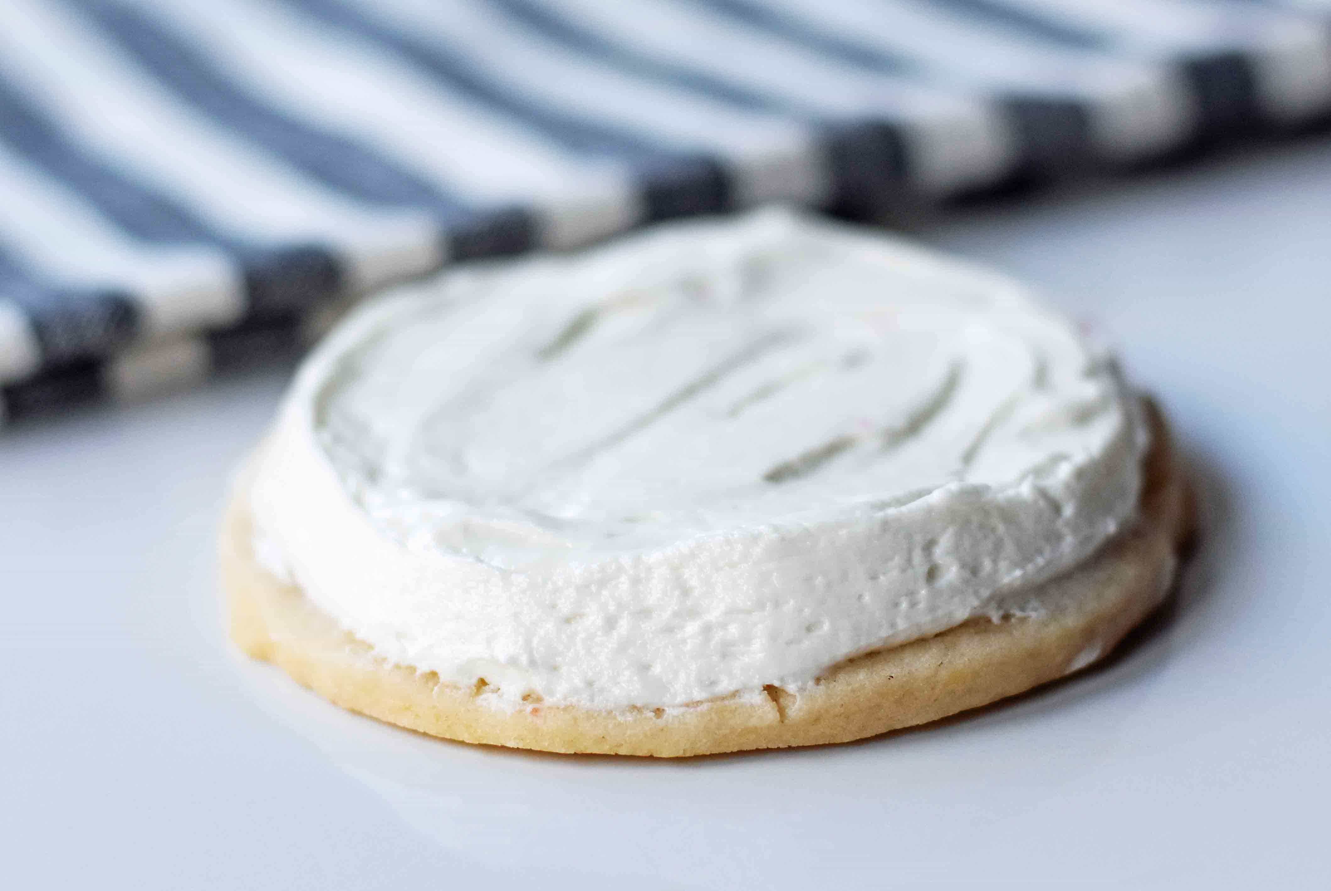 Soft Chewy Sugar Cookies with creamy buttercream frosting. The BEST soft frosted sugar cookies ever. How to make soft and chewy sugar cookies at home. www.modernhoney.com