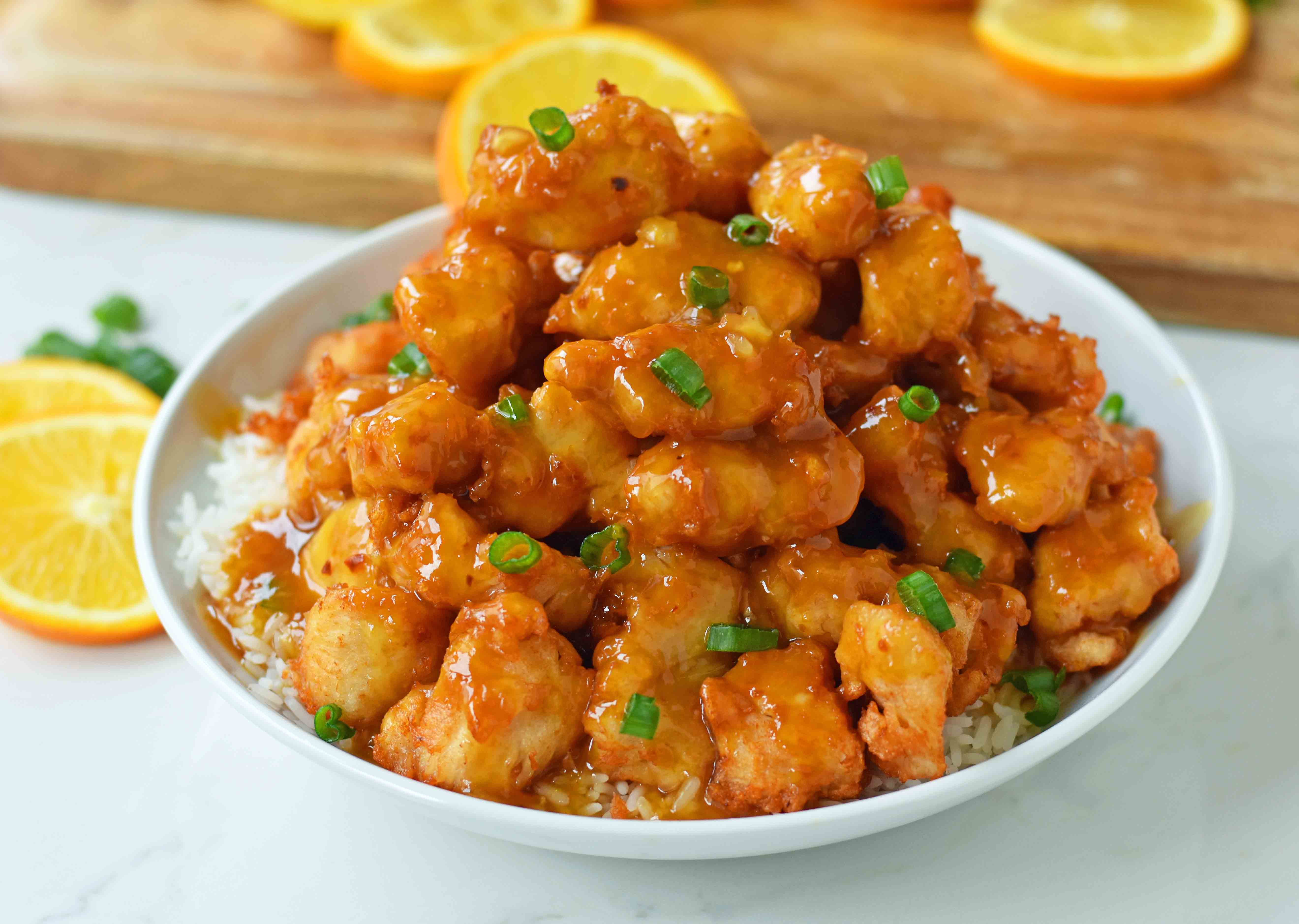 Chinese Orange Chicken that is better than take-out. How to make ORANGE CHICKEN at home with a sweet orange sauce. www.modernhoney.com
