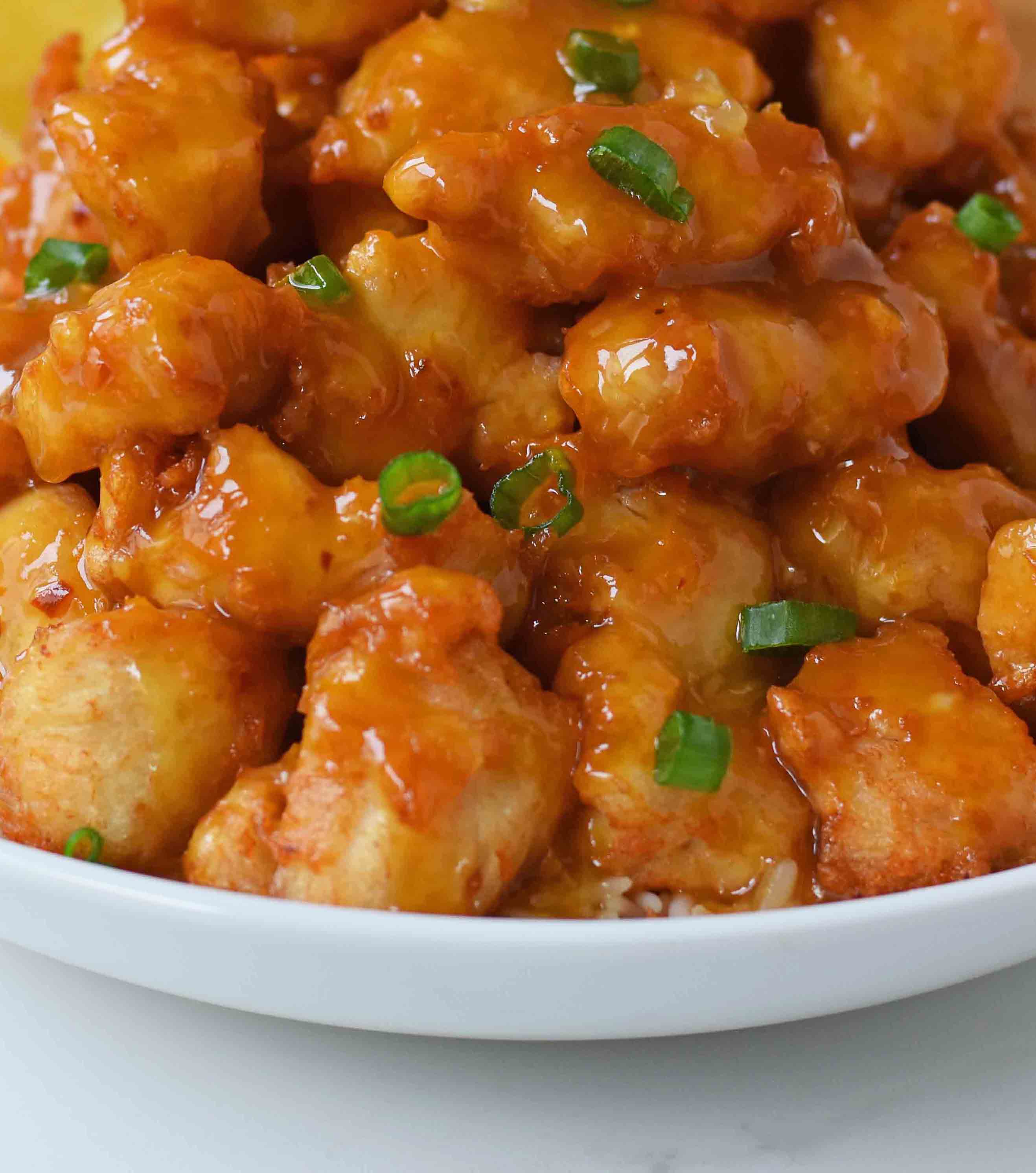 Chinese Orange Chicken that is better than take-out. How to make ORANGE CHICKEN at home with a sweet orange sauce. www.modernhoney.com