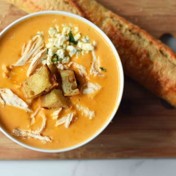 Creamy Buffalo Chicken Soup. All of the flavor of chicken wings in one soup. A tangy, creamy, and spicy buffalo chicken soup. www.modernhoney.com