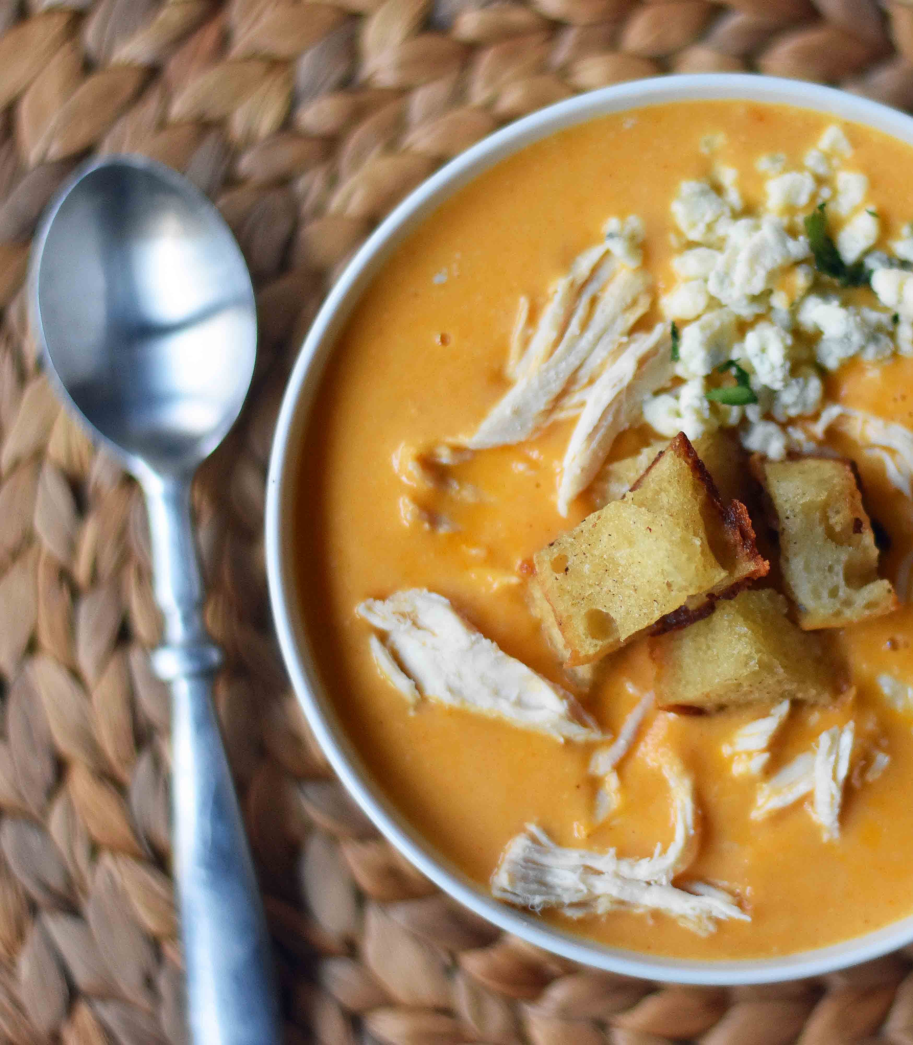 Creamy Buffalo Chicken Soup. All of the flavor of chicken wings in one soup. A tangy, creamy, and spicy buffalo chicken soup. www.modernhoney.com