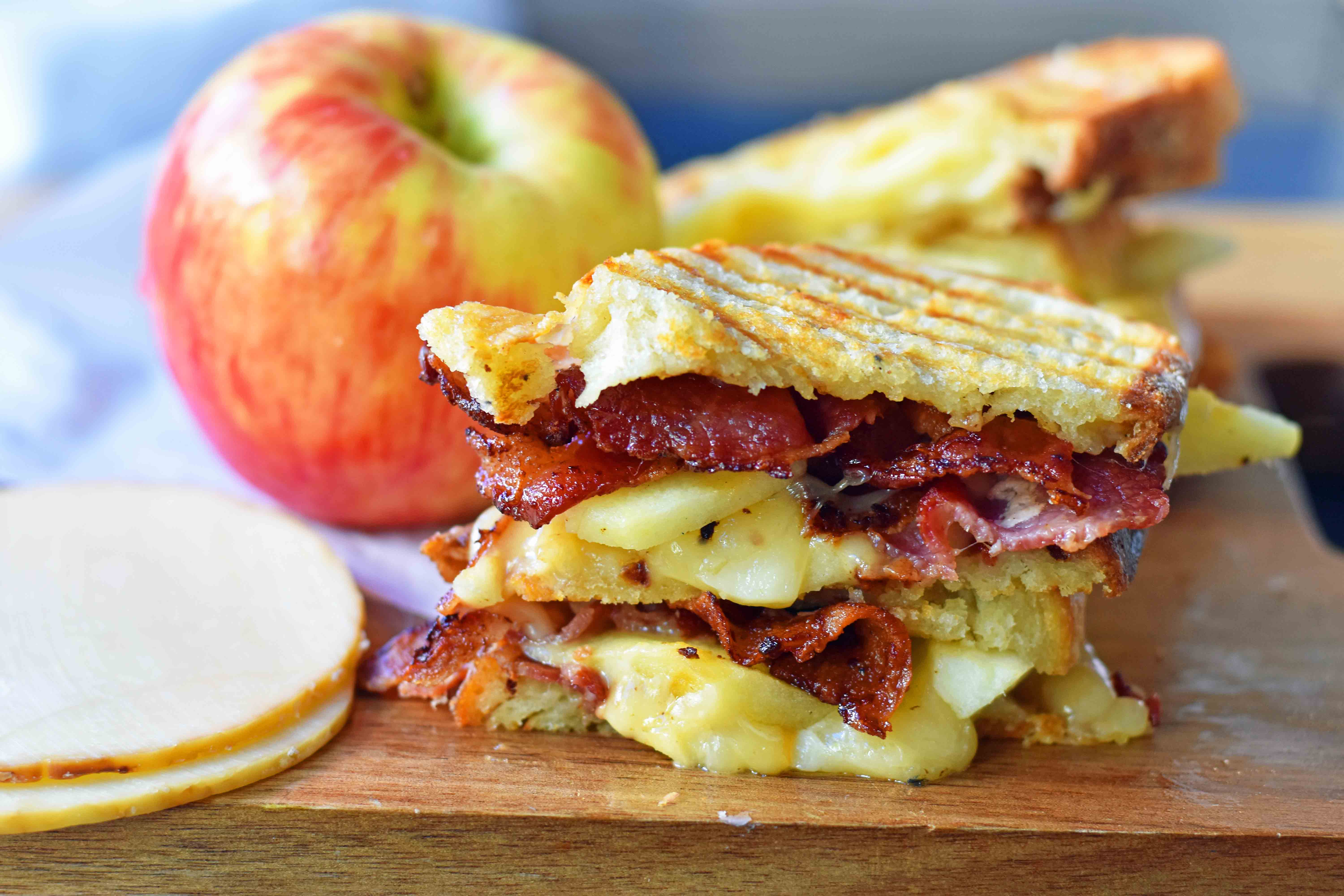 A gourmet grilled cheese sandwich made with smoked gouda cheese, sweet crisp Honeycrisp apple slices, and crispy bacon all on sourdough bread. How to make the perfect grilled cheese sandwich. Tips on how to make the best grilled cheese. www.modernhoney.com