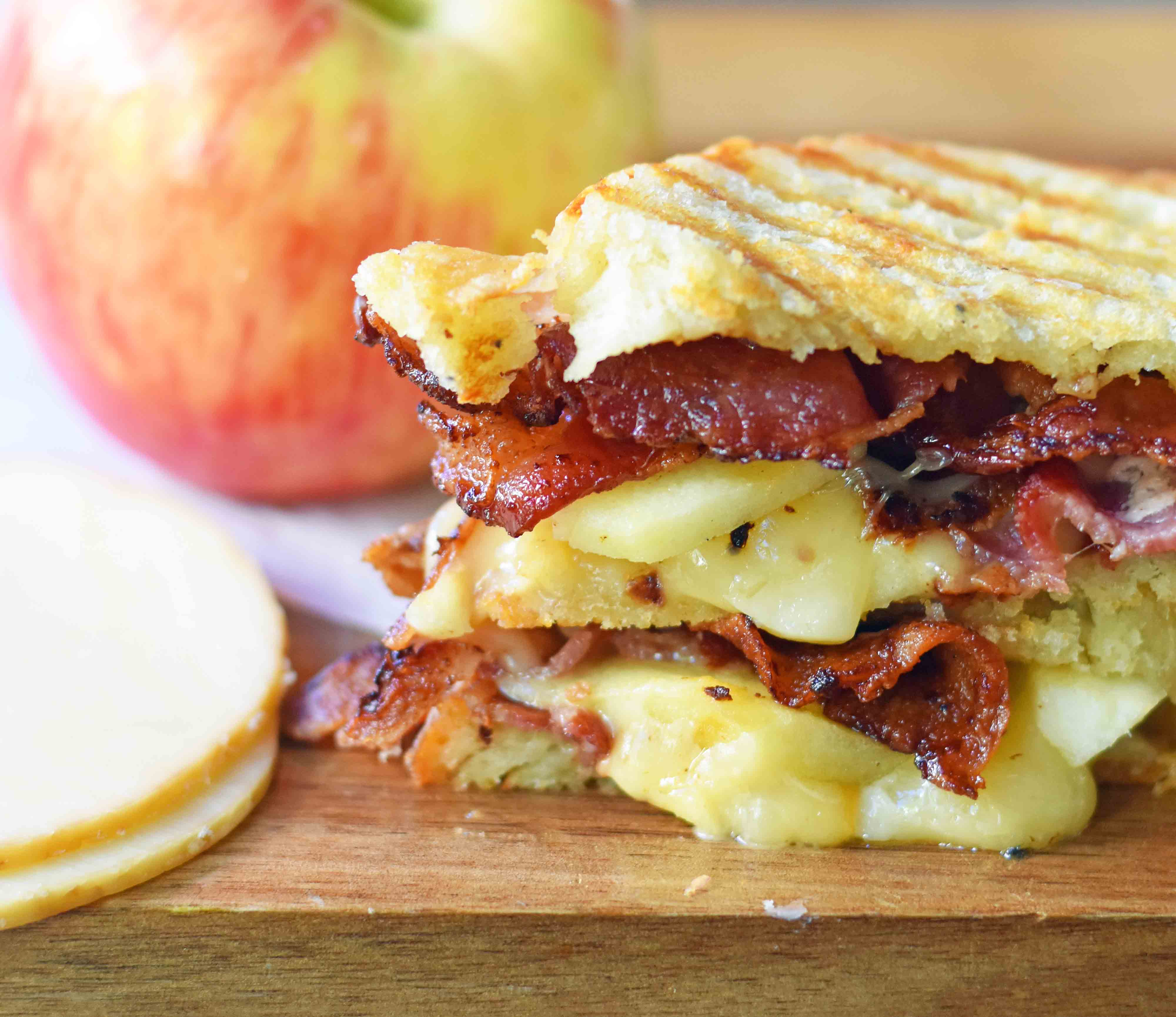 A gourmet grilled cheese sandwich made with smoked gouda cheese, sweet crisp Honeycrisp apple slices, and crispy bacon all on sourdough bread. How to make the perfect grilled cheese sandwich. Tips on how to make the best grilled cheese. www.modernhoney.com