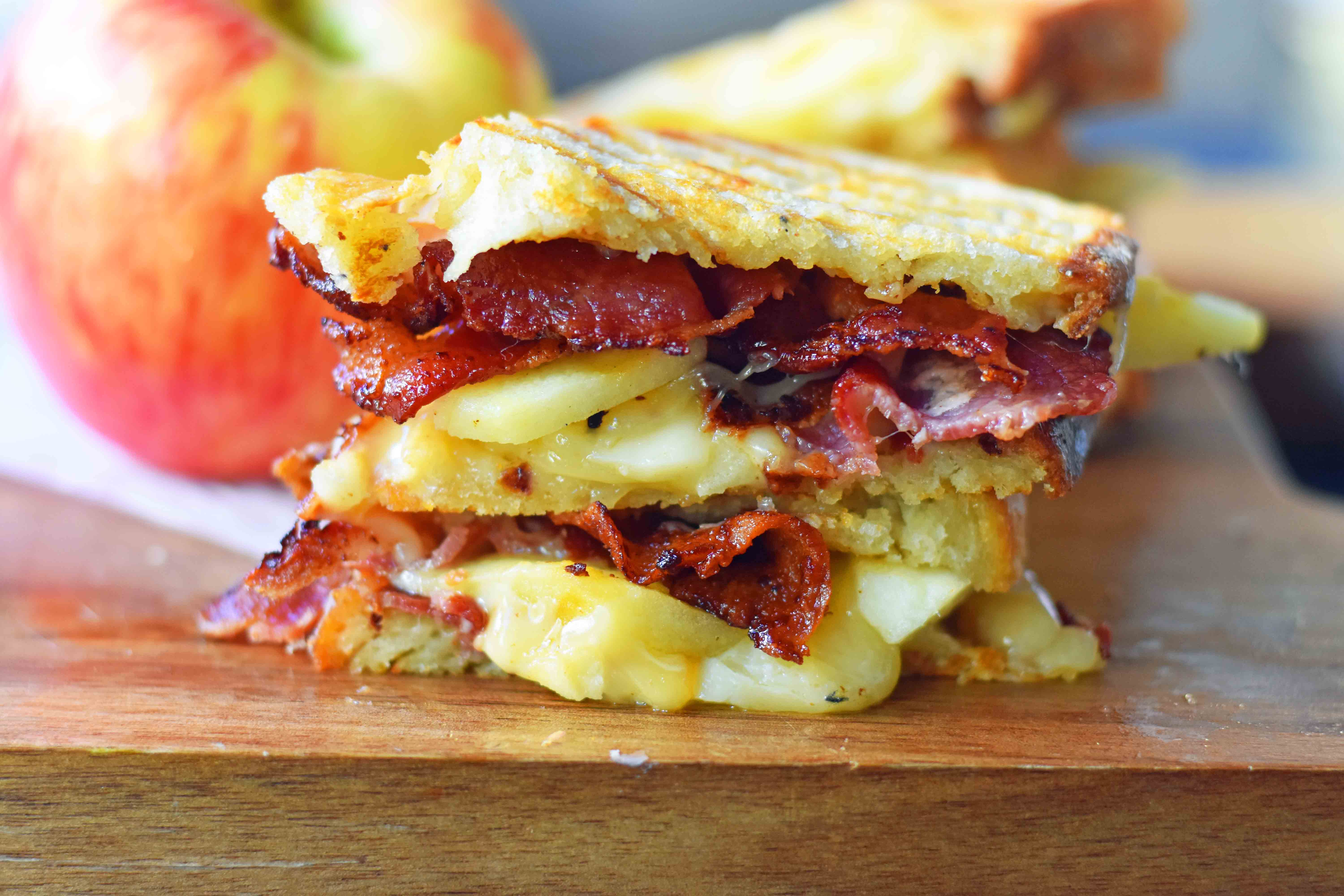 A gourmet grilled cheese sandwich made with smoked gouda cheese, sweet crisp Honeycrisp apple slices, and crispy bacon all on sourdough bread. How to make the perfect grilled cheese sandwich. Tips on how to make the best grilled cheese. www.modernhoney.com