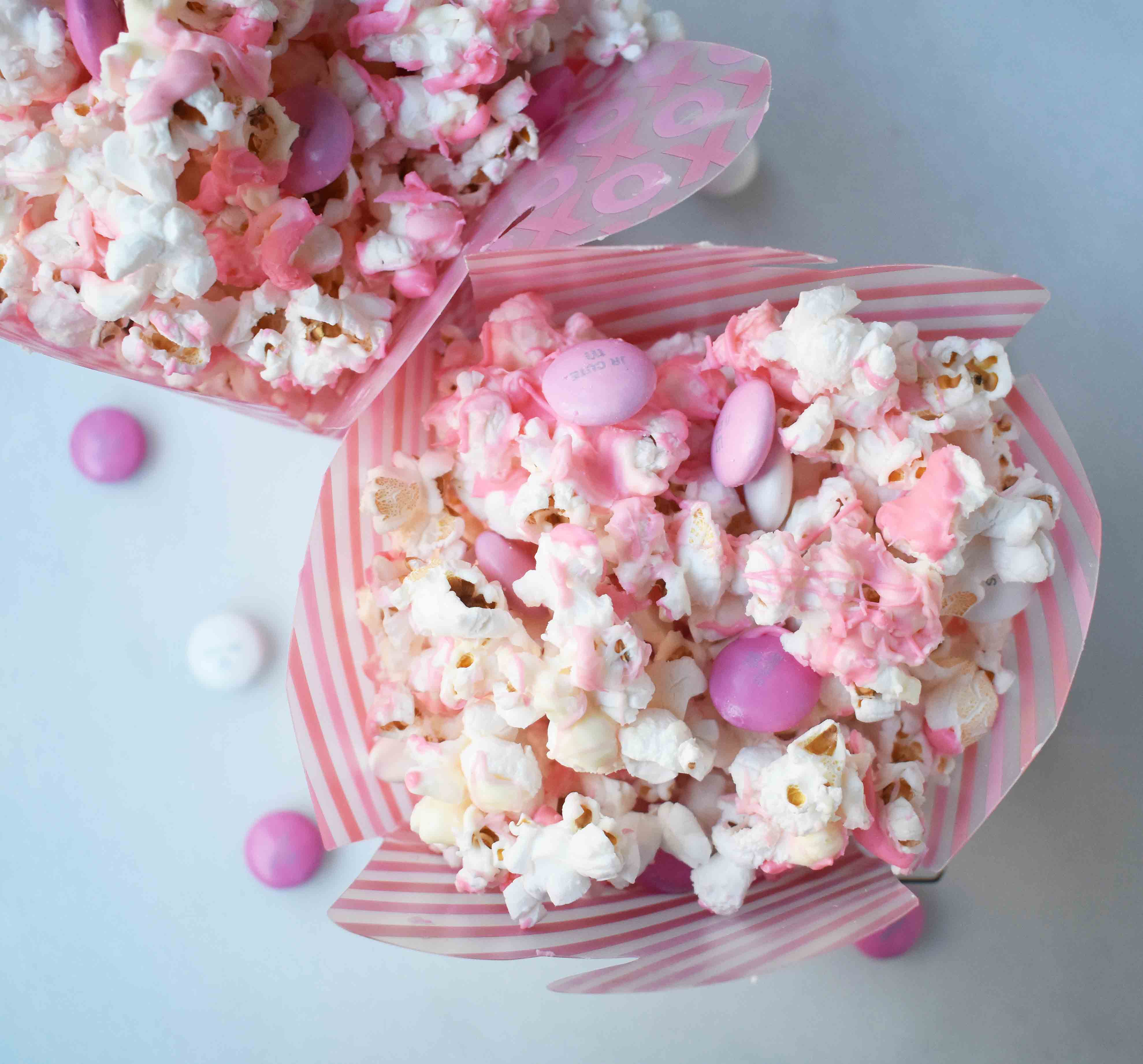 Valentine's White Chocolate M & M Popcorn. Salted popcorn drizzled with Ghirardelli white chocolate and M & M's. A perfect salty sweet treat. www.modernhoney.com