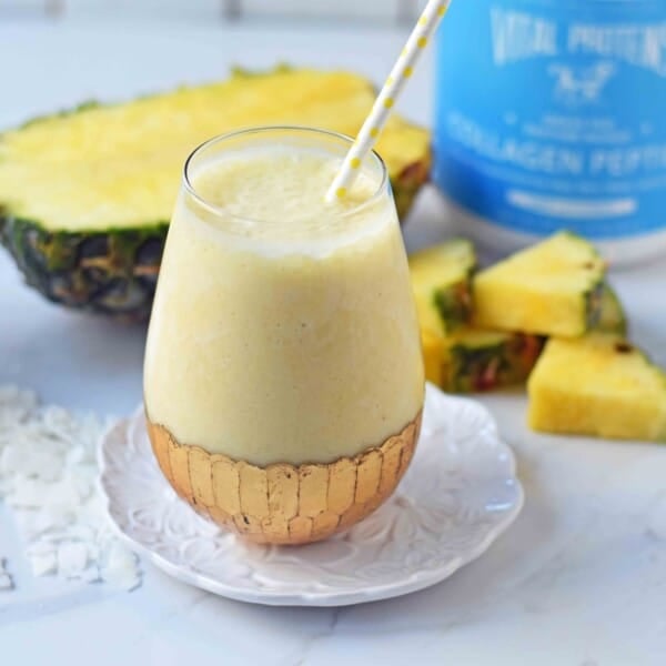 Healthy Pina Colada Smoothie. Fresh pineapple, coconut milk, banana, a touch of honey, and optional coconut yogurt. A creamy sweet healthy coconut pineapple smoothie. www.modernhoney.com