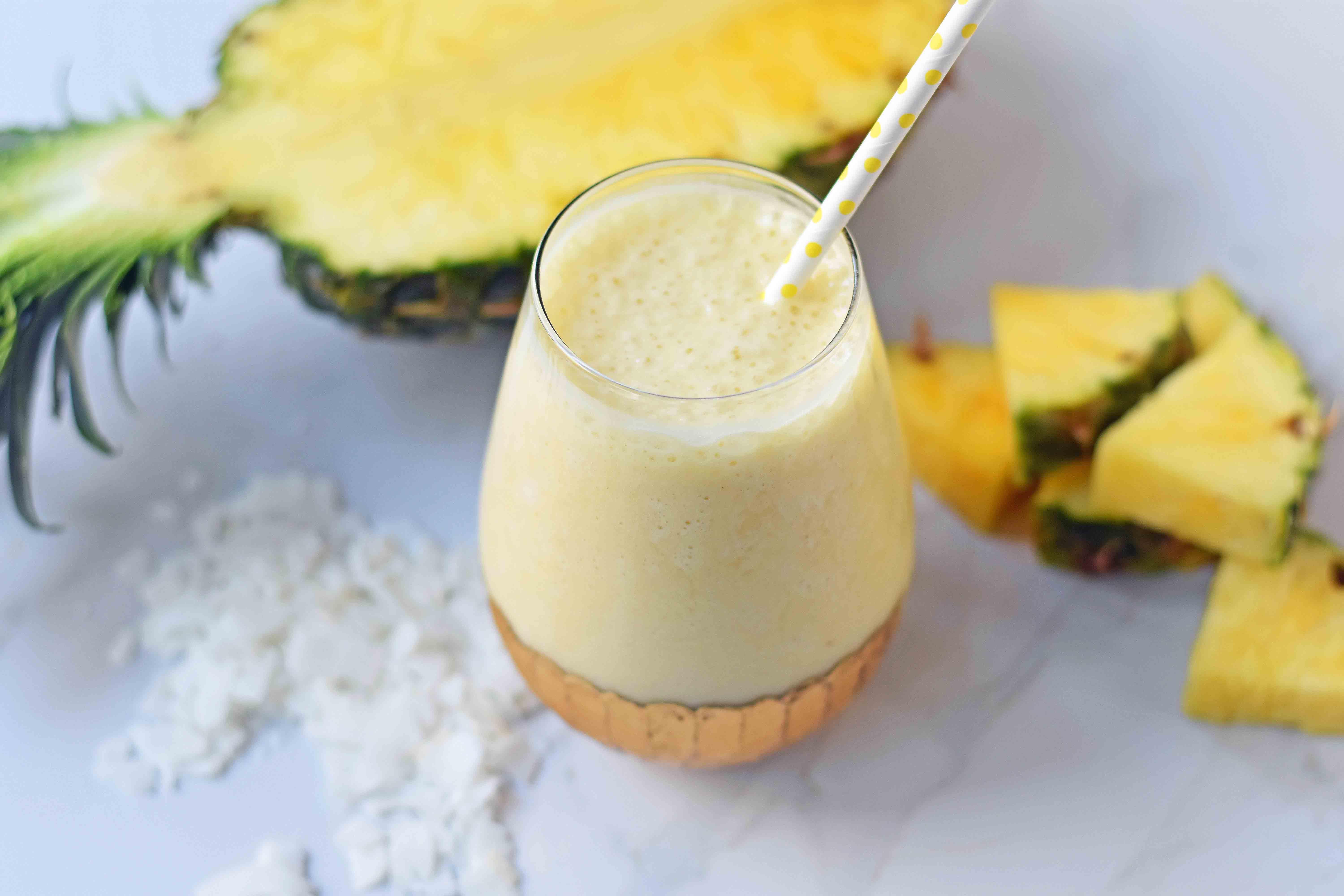 Healthy Pina Colada Smoothie. Fresh pineapple, coconut milk, banana, a touch of honey, and optional coconut yogurt. A creamy sweet healthy coconut pineapple smoothie. www.modernhoney.com