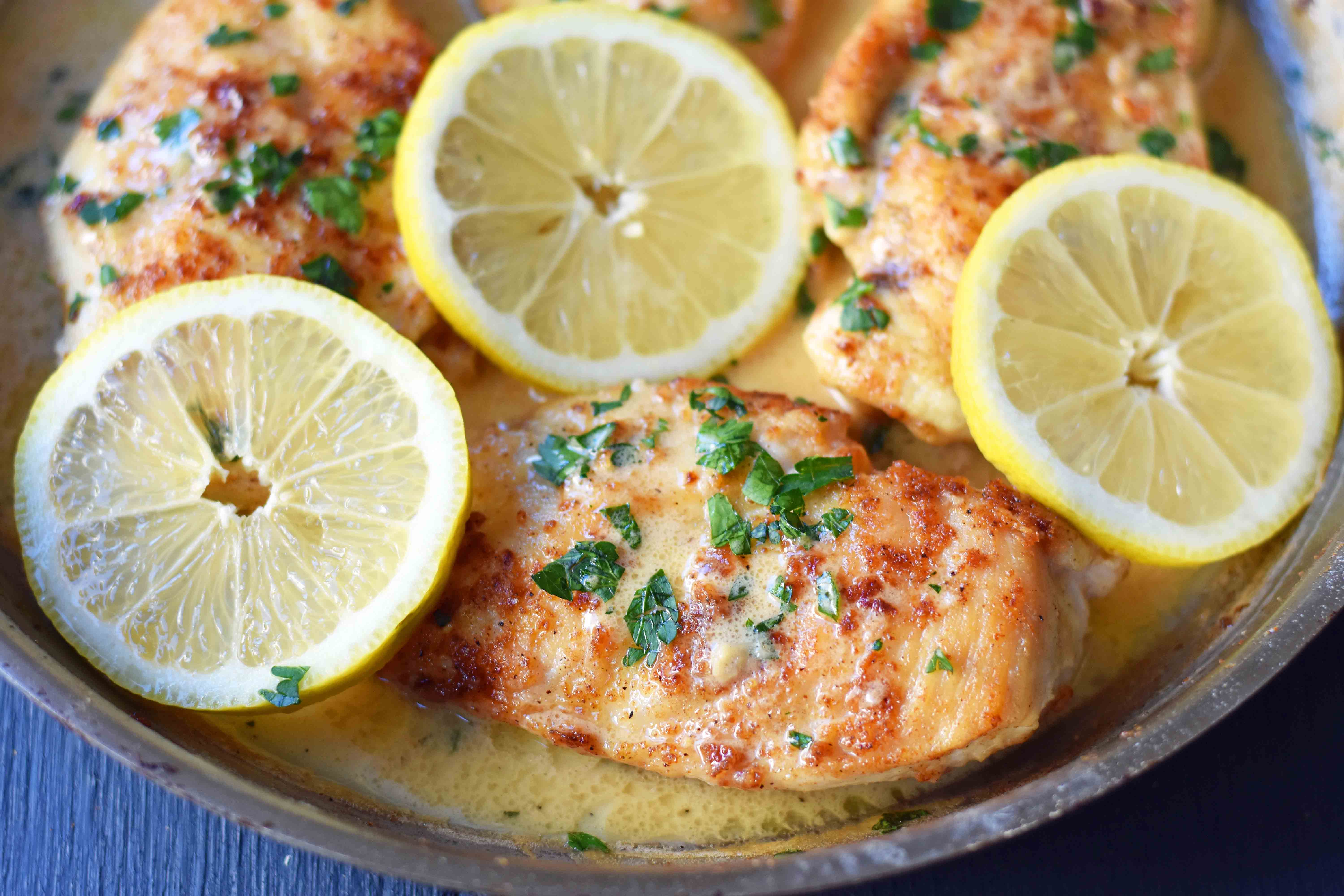 This simple 20-minute Skillet Lemon Butter Chicken is a pan-fried chicken in a silky lemon butter sauce. Chicken sauteed in butter and olive oil and topped with a creamy lemon butter sauce. An easy weeknight dinner that your whole family will love! www.modernhoney.com
