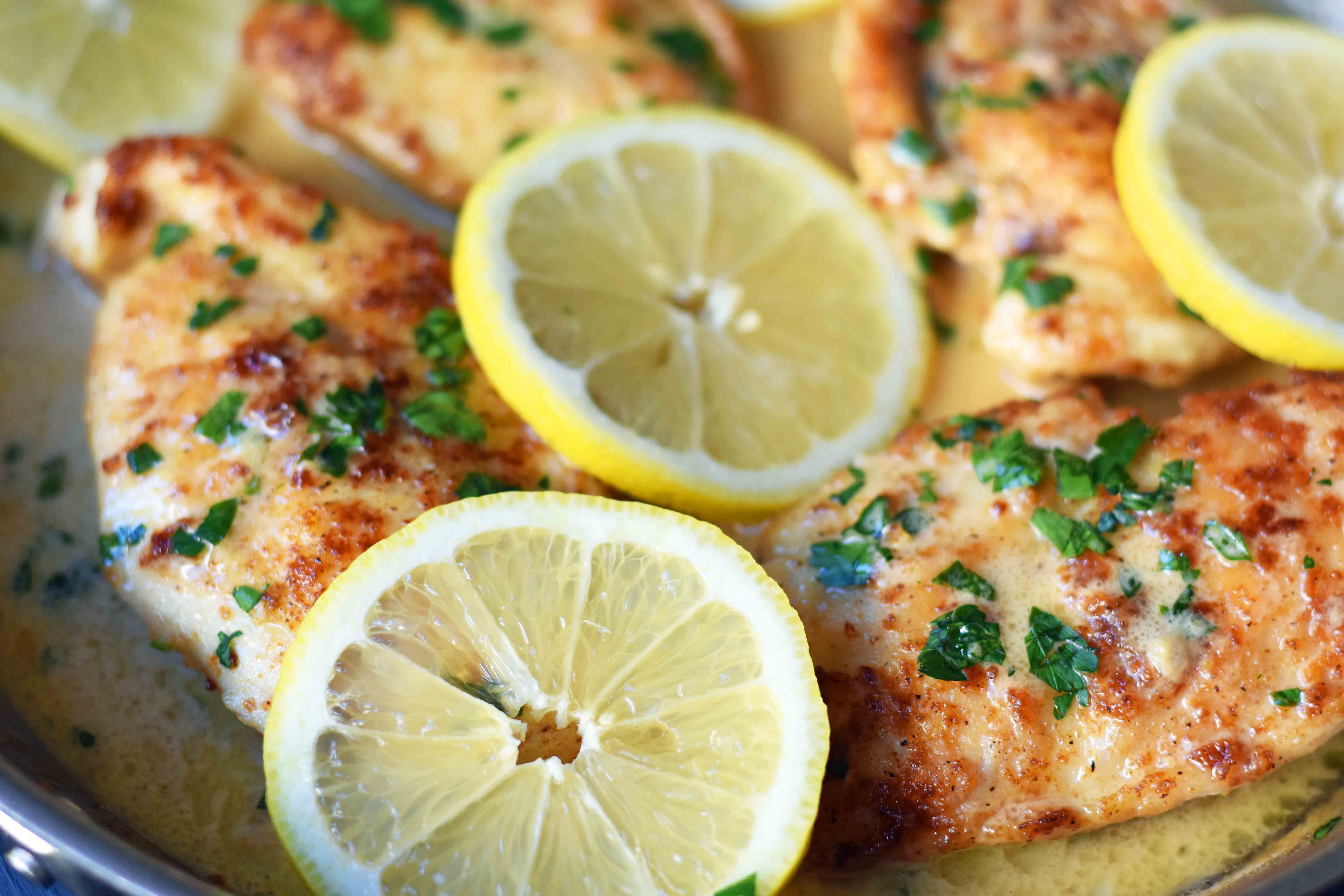 This simple 20-minute Skillet Lemon Butter Chicken is a pan-fried chicken in a silky lemon butter sauce. Chicken sauteed in butter and olive oil and topped with a creamy lemon butter sauce. An easy weeknight dinner that your whole family will love! www.modernhoney.com