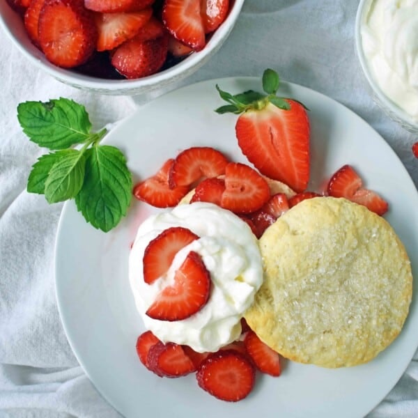 Strawberry Shortcake with Sweet Biscuits, Sugared Strawberries, and Homemade Sweetened Whipped Cream. The BEST Strawberry Shortcake Recipe. A Southern classic Strawberry Shortcake with biscuits. www.modernhoney.com