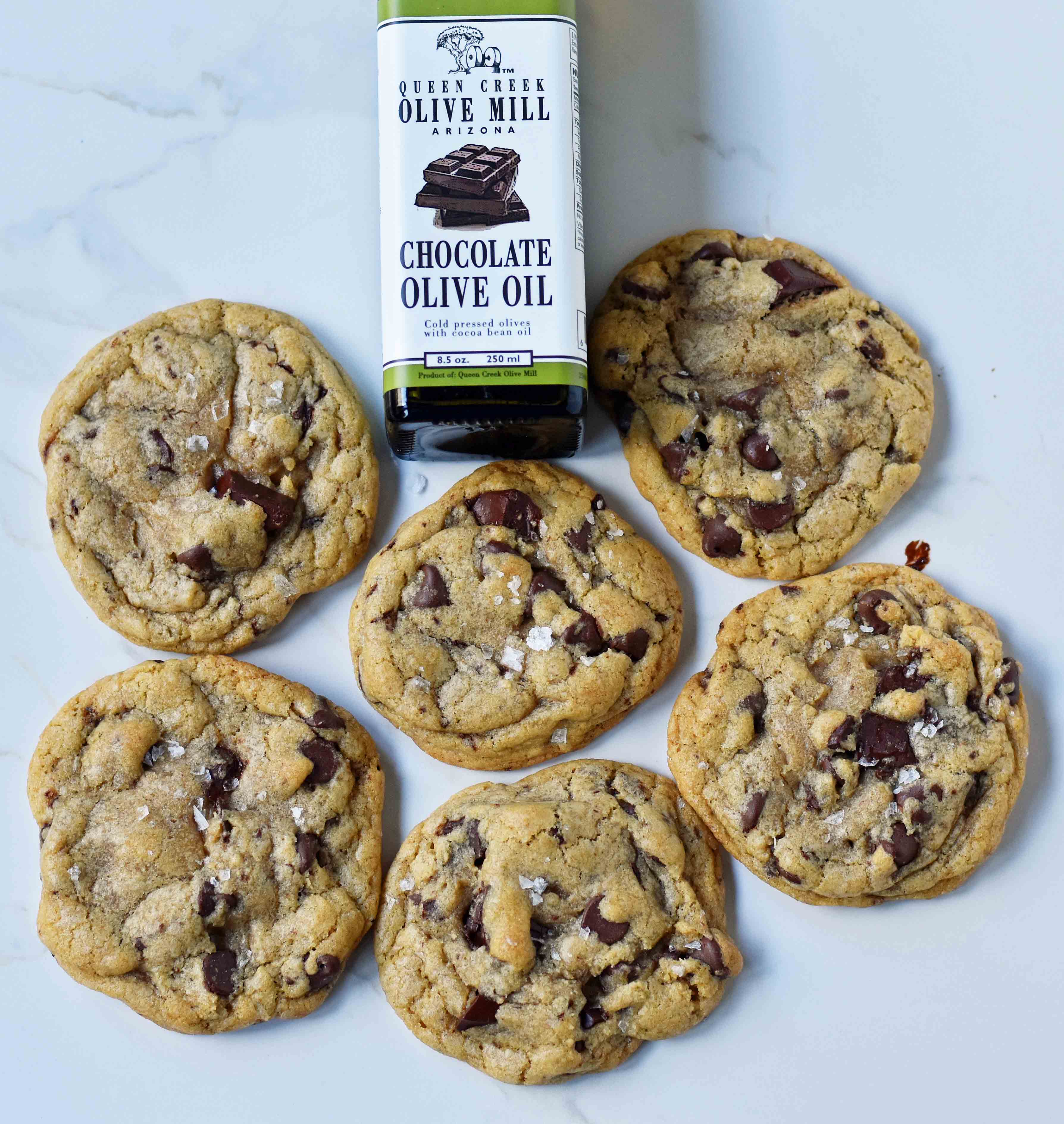 Dark Chocolate Chunk Olive Oil Cookies. Chewy and crispy chocolate chip cookies made with olive oil and butter. The perfect chocolate chip cookie with oil. www.modernhoney.com