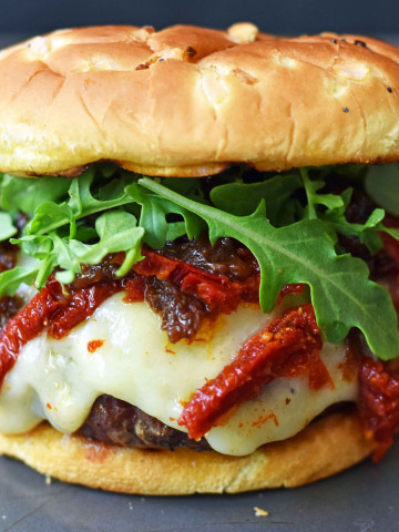 Brie Burger with Caramelized Onions and Sundried Tomatoes The Ultimate Burger with melted Brie Cheese, Sundried Tomatoes, Queen Creek Olive Mill Caramelized Red Onion Fig Tapenade, and Arugula. How to make the perfect burger. www.modernhoney.com