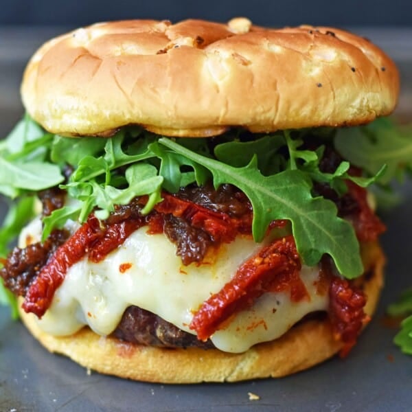Brie Burger with Caramelized Onions and Sundried Tomatoes The Ultimate Burger with melted Brie Cheese, Sundried Tomatoes, Queen Creek Olive Mill Caramelized Red Onion Fig Tapenade, and Arugula. How to make the perfect burger. www.modernhoney.com