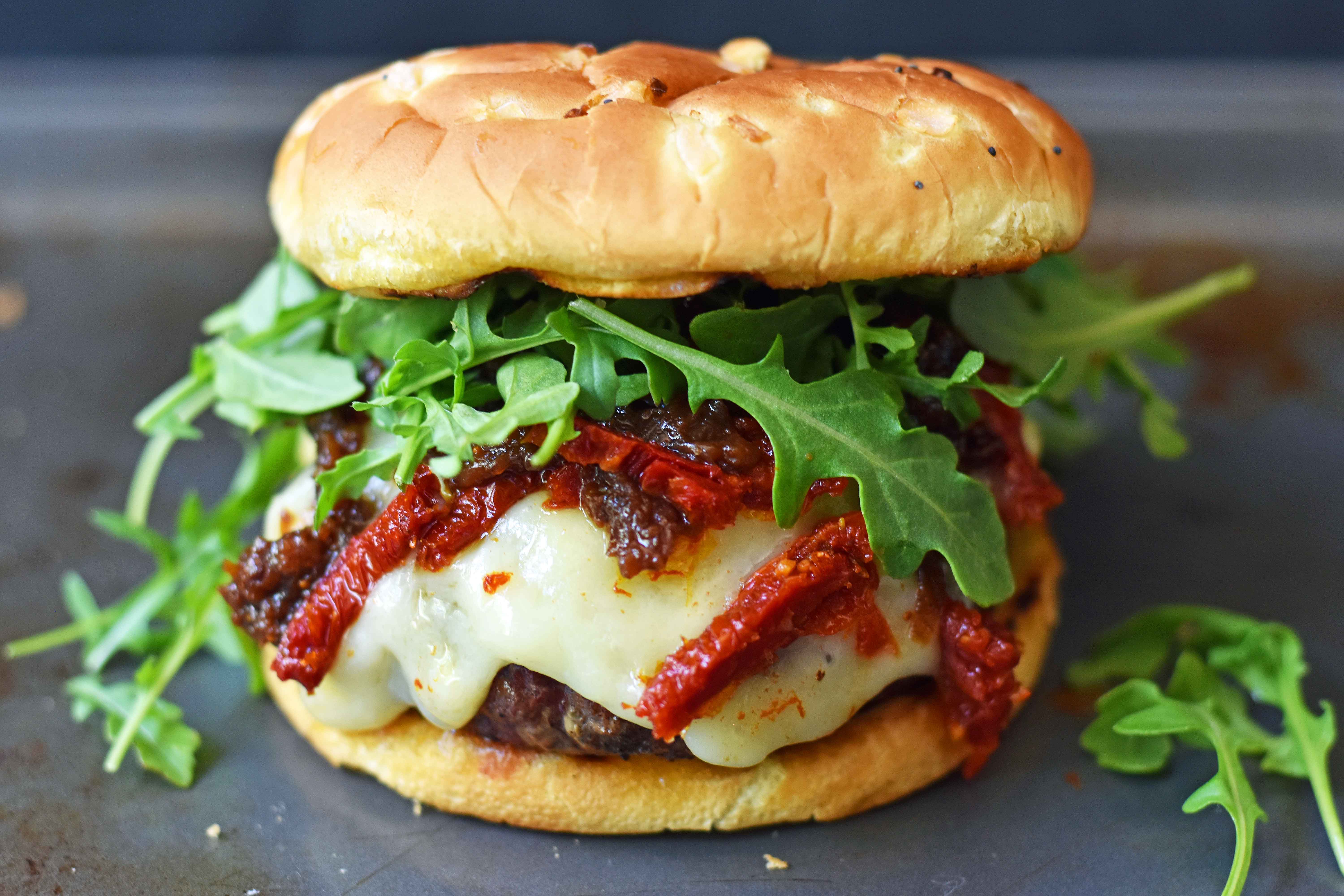 Brie Burger with Caramelized Onions and Sundried Tomatoes The Ultimate Burger with melted Brie Cheese, Sundried Tomatoes, Queen Creek Olive Mill Caramelized Red Onion Fig Tapenade, and Arugula. How to make the perfect burger. www.modernhoney.com 